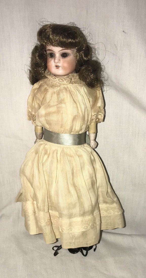 DOLLHOUSE, DOLLS, MINIATURES: Antique bisque head doll marked Ruth 16/0, probably a character doll by Armand Marseilles, handpainted face, sleepy eyes, open mouth, teeth, bisque forearms and hands, jointed leather body, cloth lowe