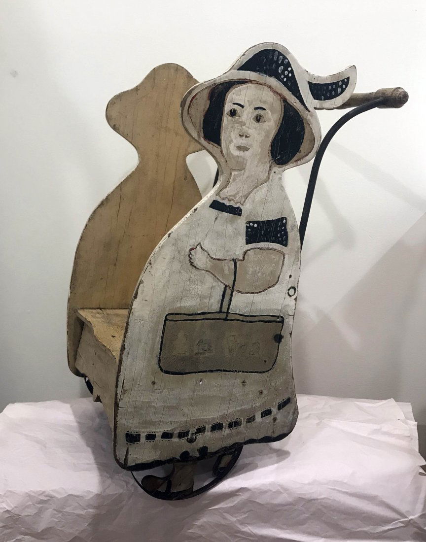 DOLLHOUSE, DOLLS, MINIATURES: Wooden 3 wheel coach, sides w/paint decorated figure of a lady, handle w/iron supports, 20 1/2" T x 11" W x 14 1/2-15" D