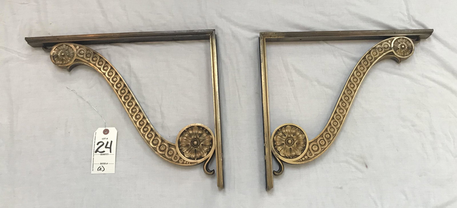 Pair of Vintage Bronze Shelf Brackets: Matched pair of vintage bronze wall mounted shelf bracekts, scroll design w/floral rosettes, figure eight pattern, casting no. A24 663 C247-4; 15" T x 17 3/4" D; total wtg. 26 lbs Approximate Weight a