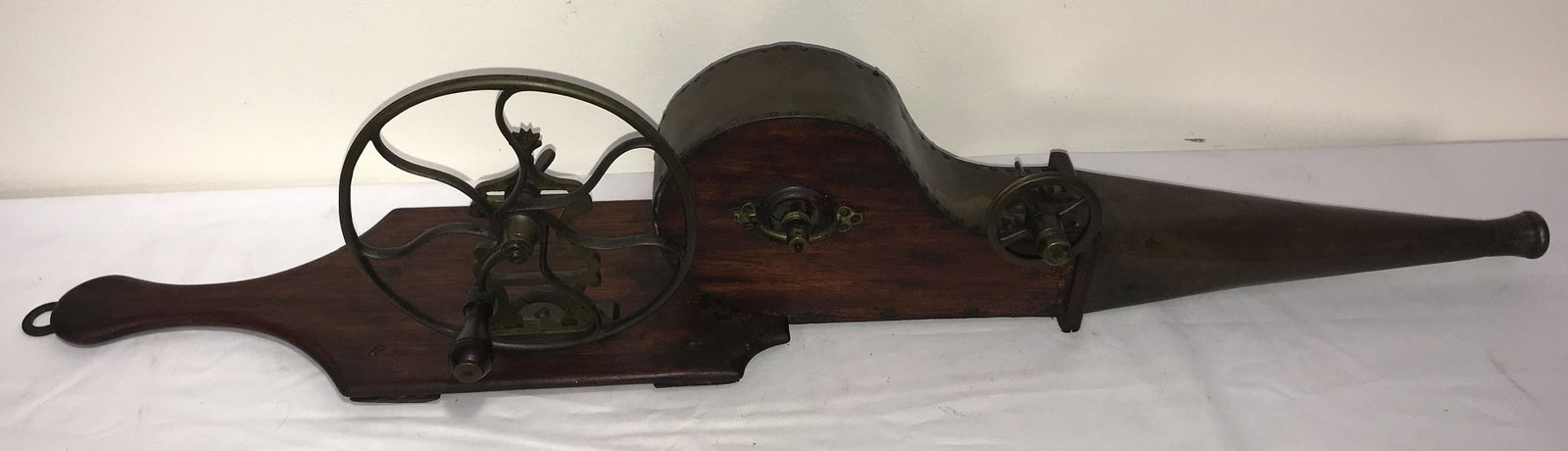 Anitque Bellows: Antique brass and wood bellows, manual crank wheel driven,, belt/string missing, breadboard back w/hook for hanging, brass casing and tip, shows old repair, overall length approx. 36 1/2" x 8 3/4" T (