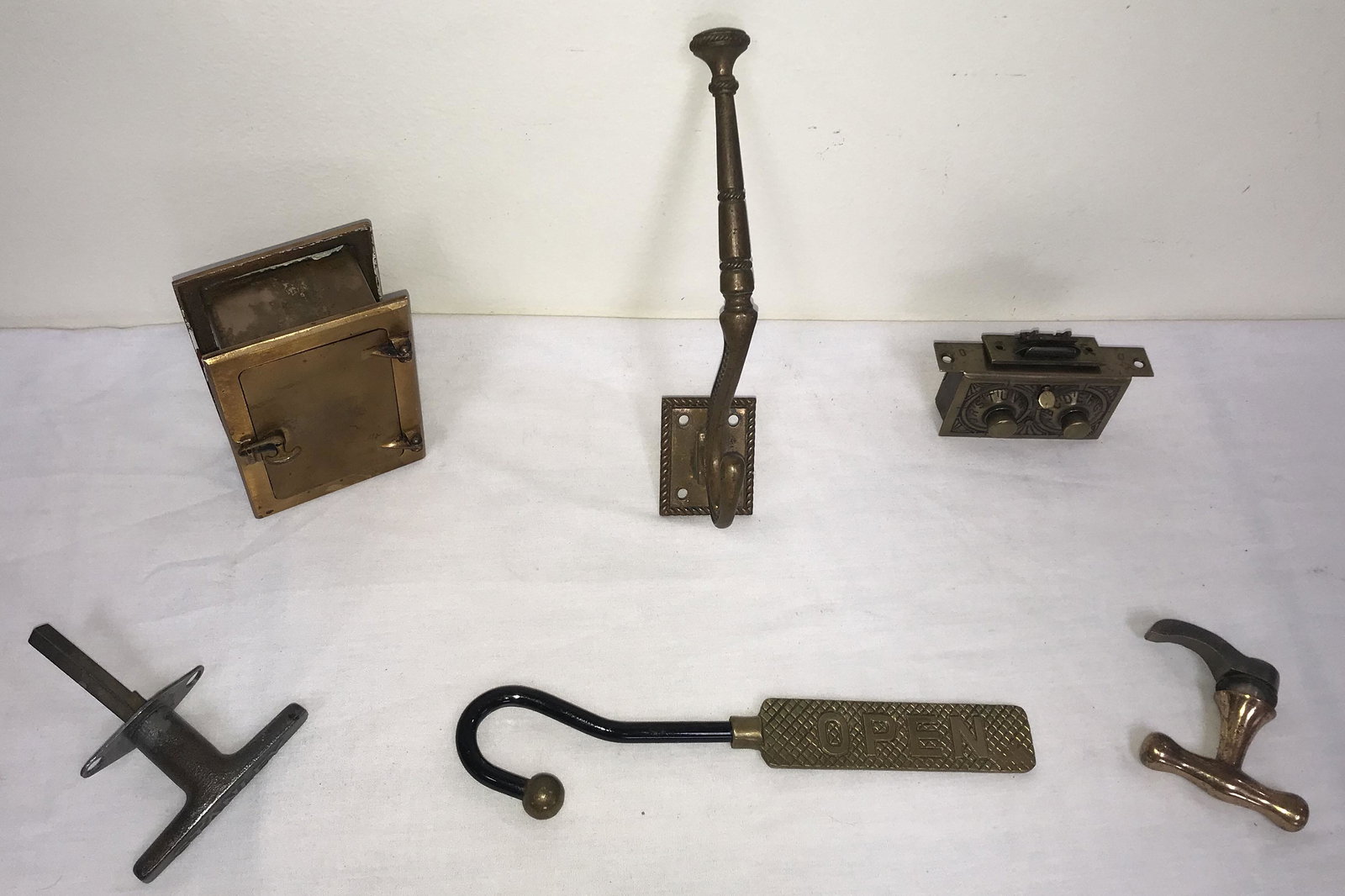 Vintage Metal Ware Architectural Items: Vintage metal ware architectural items: brass wall mounted coat/hat hook marked No. 24 26, 9" T x 3 1/8" W; brass double dial combination lock by The Keyless Lock Co., Indianapolis, IN. USA w/combinat