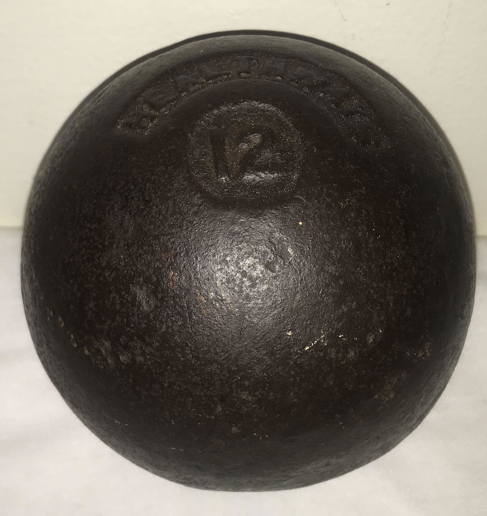 Vintage Cast Iron Shot Put: Vintage cast iron 12 lbs. shot put marked Healthways, old surface wear/patina, 4 1/4" diameter