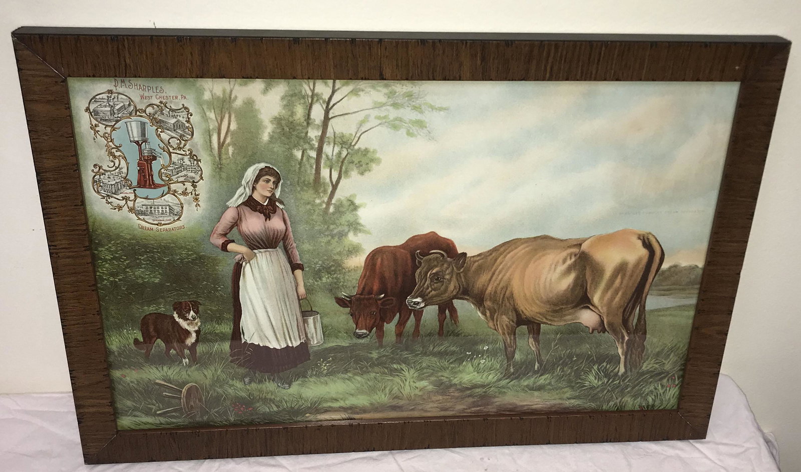 Vintage Chromolithograph-Advertising Cream Separators: Framed vintage color chromolithograph advertising P.M. Sharples, West Chester, PA, Cream Separators, landscape scene w/cows, dog and young lady carrying a milk pail frame size 13 1/2" x 20 3/8"