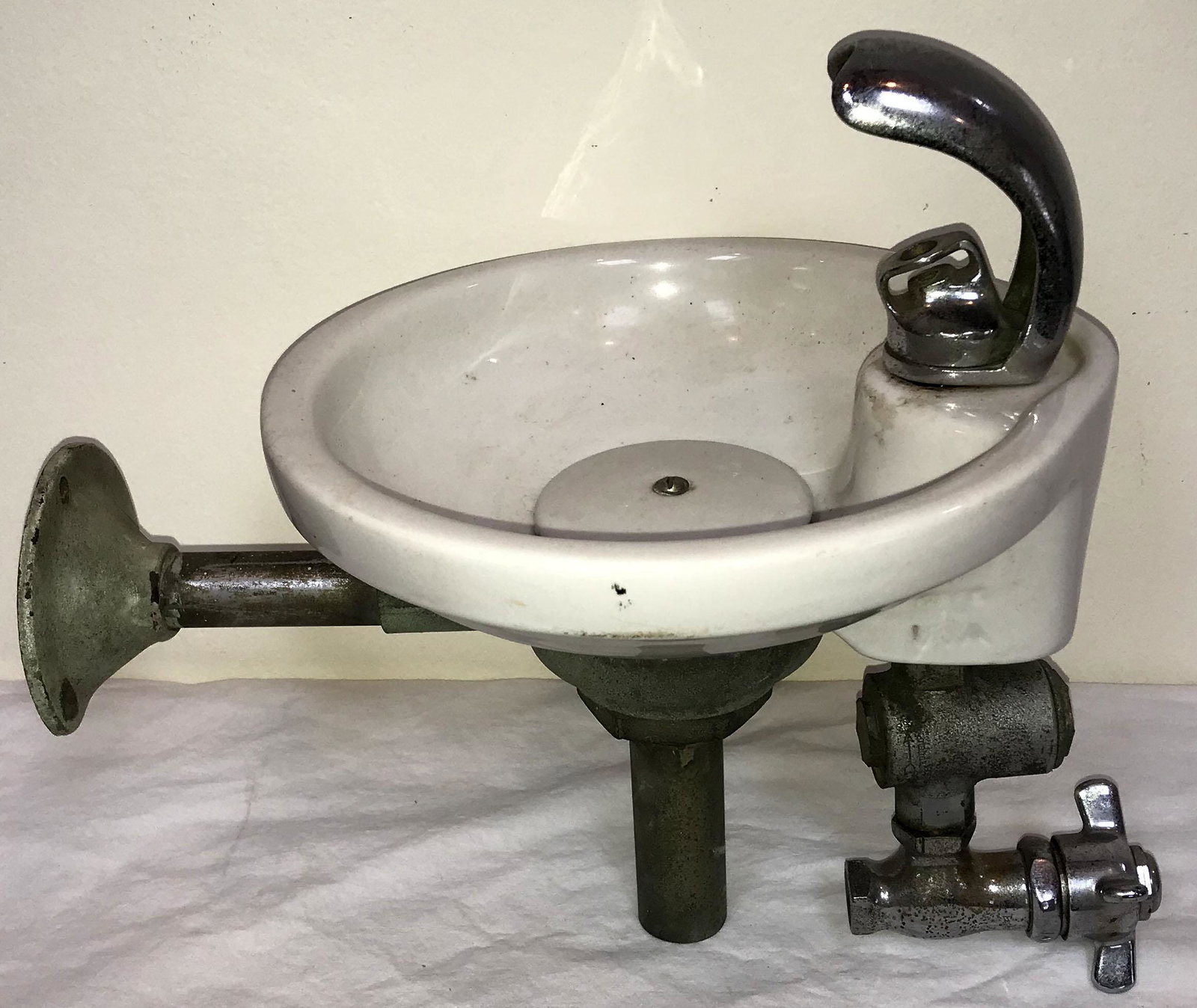 Vintage Drinking Fountain: Vintage drinking fountain w/round white porcelain bowl, nickel plated spout and handle, cast metal plumbing parts, marked Standard, overall height approx. 12" T x 9 3/4" diameter; spout 3 3/4" T
