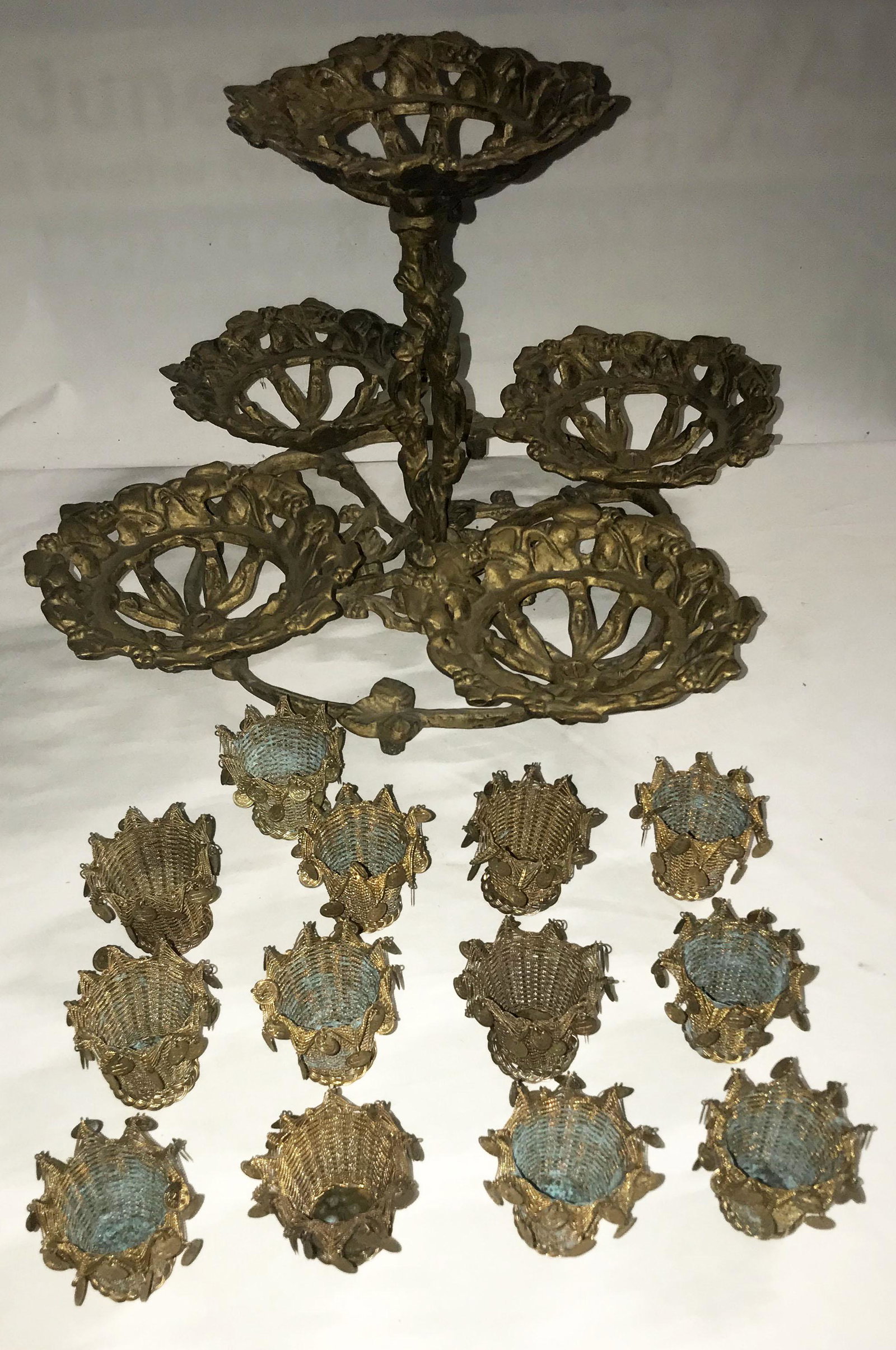 Ornate Cast Metal Stand: Ornate Victorian style cast metal table top plant stand on a round footed base w/4 reticulated holders and a center column w/matching holder, decorated w/leaves and berries, painted gold, overall cond