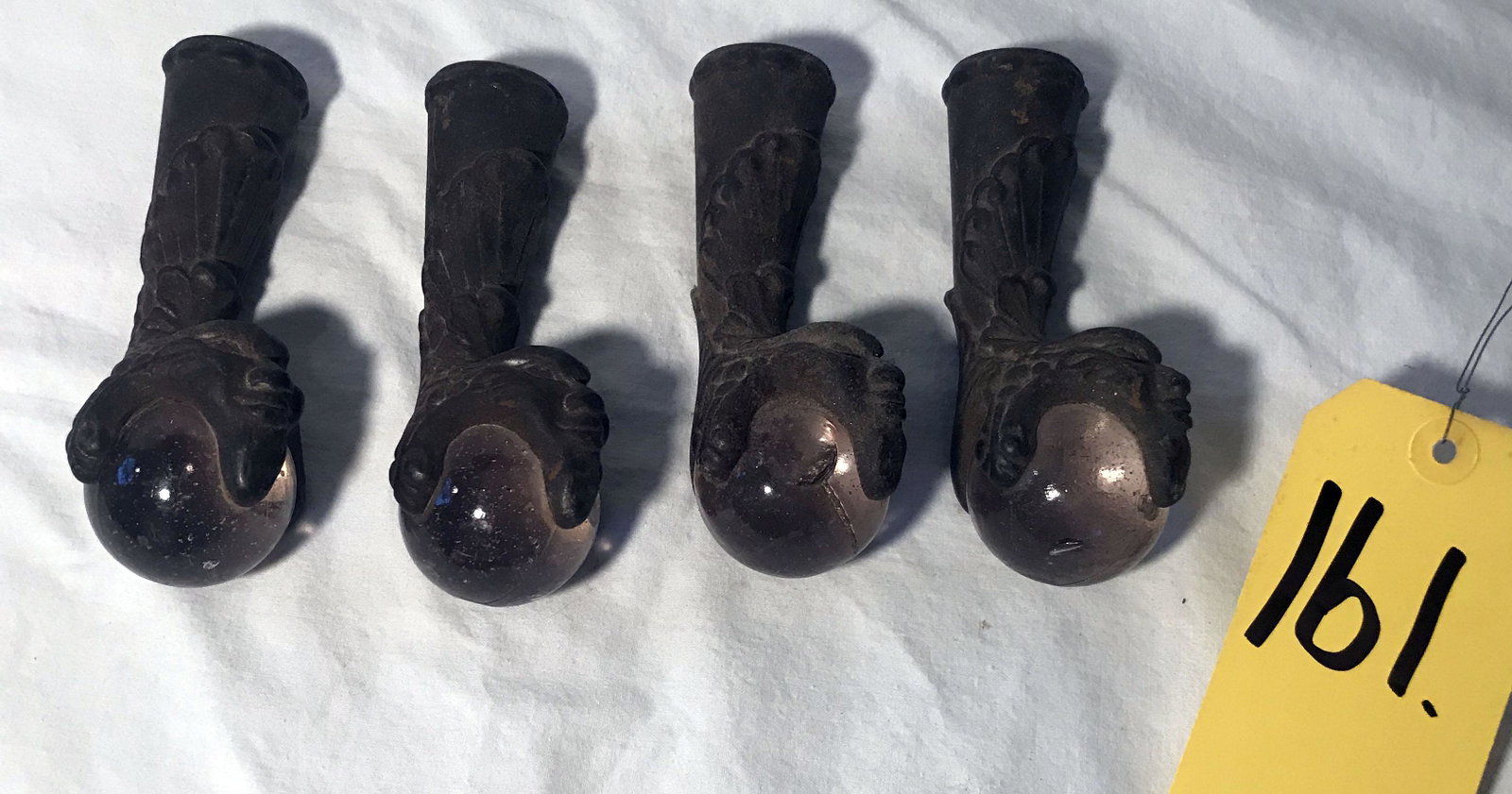 Vintage Cast Iron Furniture Feet: Set of 4 vintage cast iron furniture feet w/clear glass ball ends, shell form and face design, each w/1 hole for attachment, probably used for a plant stand, glass balls show internal bubbles, 1 has a