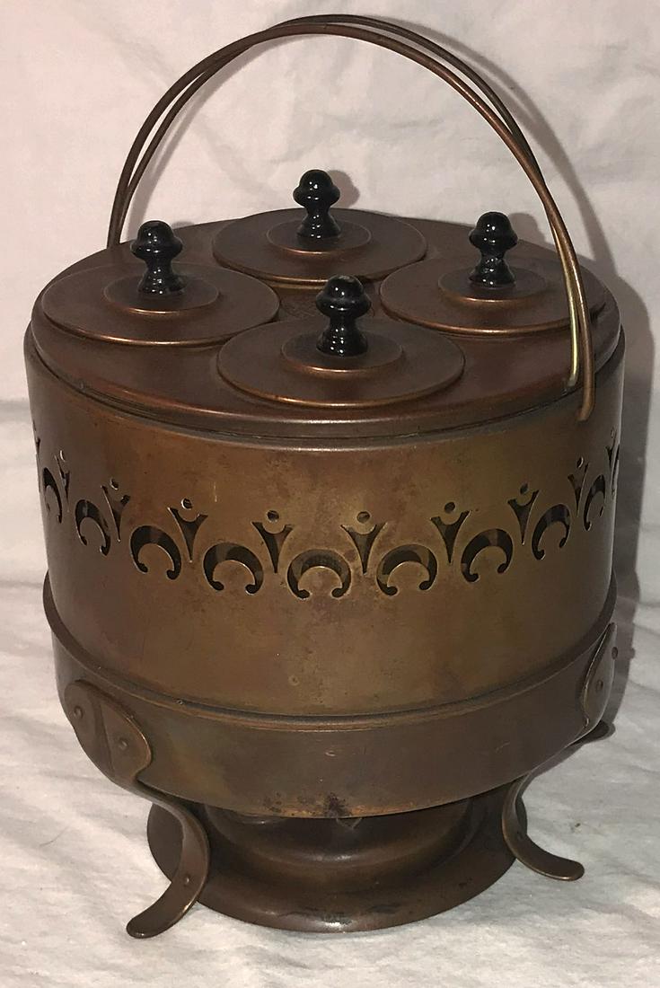 Vintage Copper Egg Boiler: Vintage copper egg boiler, marked Speciality Company Ideal Egg Boiler, Warehouse Point, CT w/2 wire handles, drum form w/4 covered holders having black knob handles, pierced/cut out design, curved leg