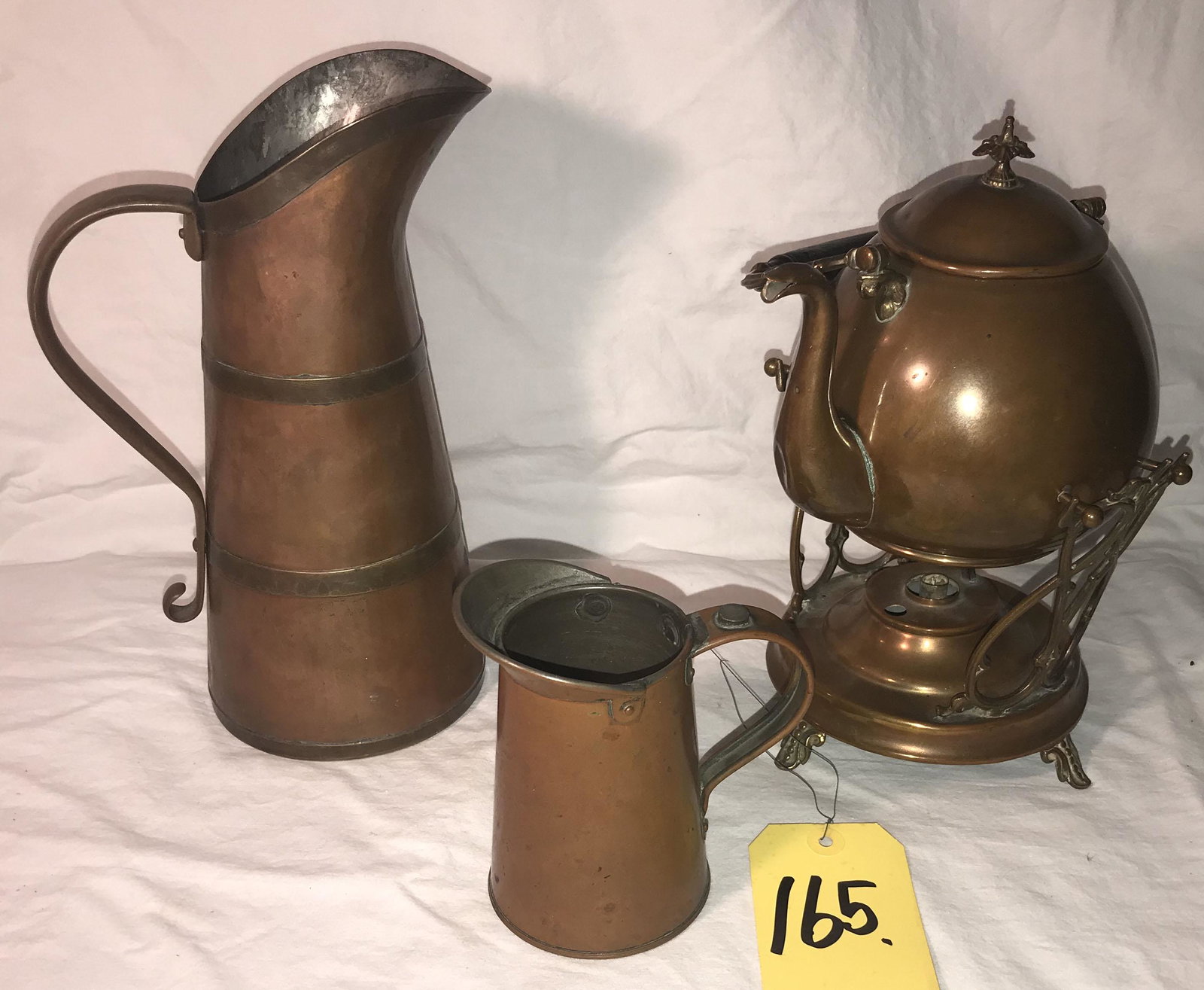 3 Pieces of Vintage Copper: 3 pieces of vintage copper: pitcher w/handle, brass staves and base, hammered design marked Haldeman and Duray Coppersmith's, Sharon Hill, PA, 10 1/8" T x 4 7/8" base diameter; 1 pint copper pitcher m