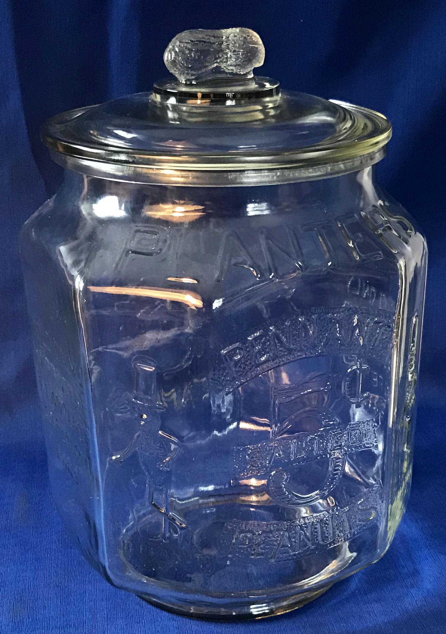 Planters Peanut Jar: Clear glass Planters Peanut Jar w/lid having peanut finial, octagonal shape, marked 5 Cent Salted Pennant Peanuts, Sold Only in Printed "Planters" Red Pennant Bags, Mr. Peanut figure on corners, norma
