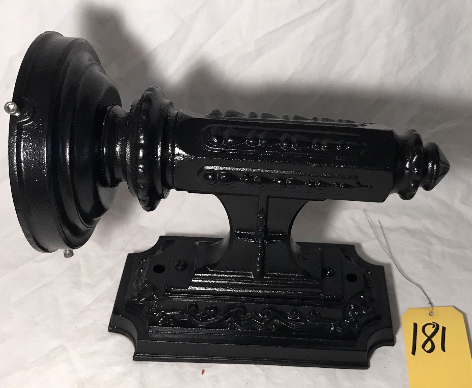 Cast Iron Lamp Sconce: Decorated cast iron lamp sconce, bead, tear drop and garland design, foundry mark G-1 and G-8, repainted and rewired, w/o shade, replaced thumbscrews, approx. 12 1/2" T x 10 3/4" Dx 6 5/8" top diamete