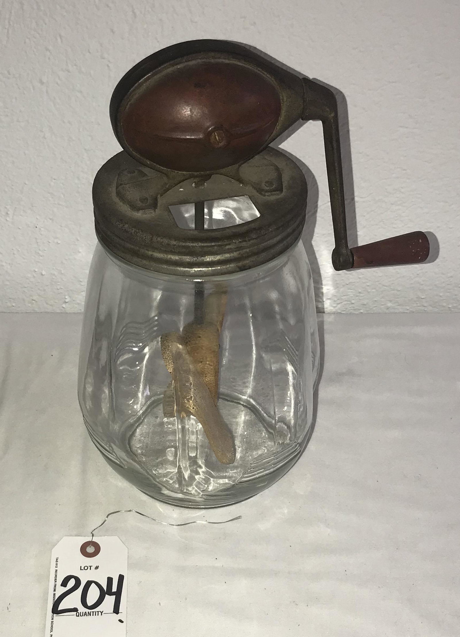 Vintage Butter Churn: Vintage butter churn, manual crank handle w/metal top and lid, threaded onto a pinched form glass base, wooden paddles, marked on base of jar Daisey Churn No. 4, St. Louis, MO., normal old wear, paint