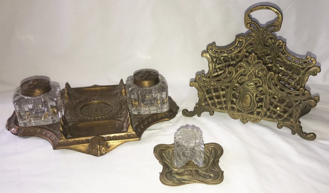 Grouping of Victorian Desk Items: Grouping of Victorian desk items: bronze/brass double inkwell stand, rectangular w/shaped corners, pen holders and trays w/2 cut glass ink bottles having round brass/bronze caps w/raised angel head fi