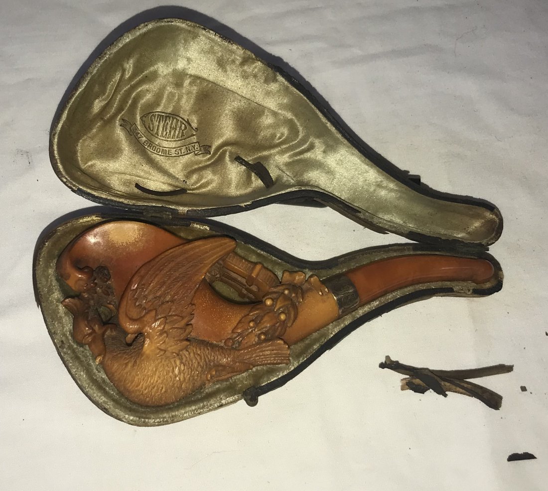 Vintage Carved Pipe by Stehr: Vintage 19th century Stehr carved pipe, bird figure w/wings surrounding pipe bowl, lyre form design and bow, engraved gold colored band-B A M to J Thiede '98 w/original amber type mouth piece, used co