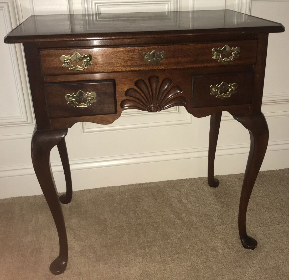 Stylized Queen Anne Lowboy: Stylized Queen Anne mahogany lowboy, molded top, 1 full length and 2 third length drawers, brass batwing pulls, center shell carving, cabriole legs pad feet by Councill Craftsman Furniture