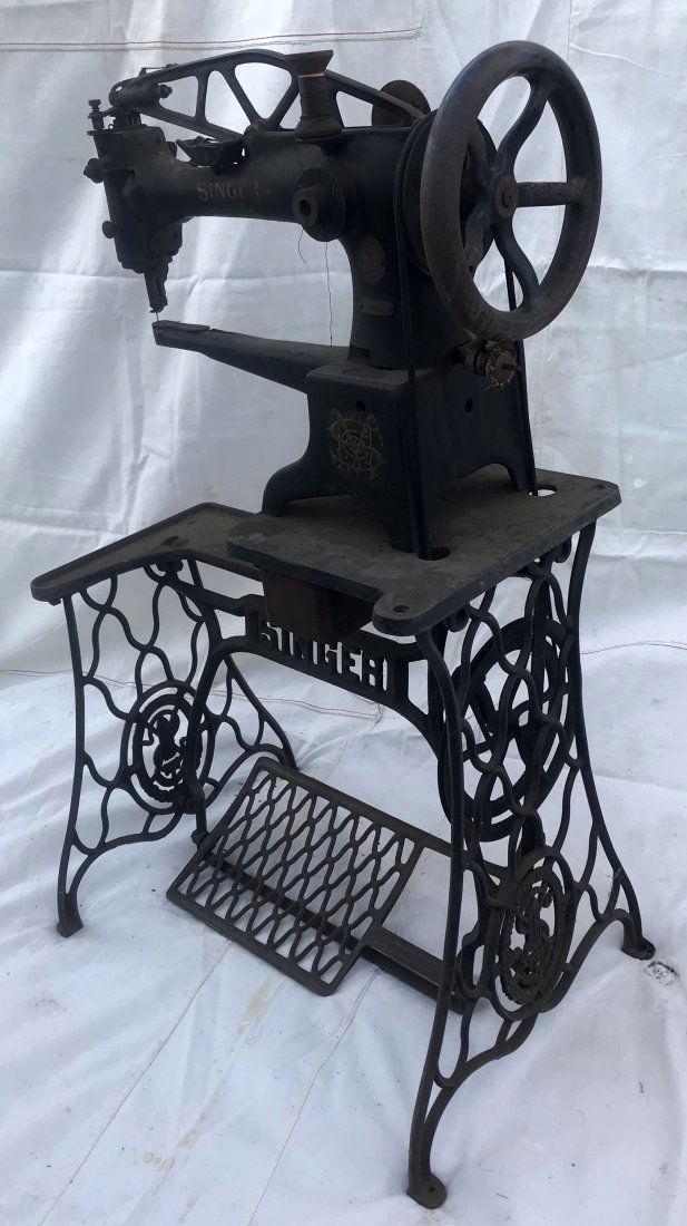 Antique Singer Model 29 Sewing Machine: Antique Singer Model 29 treadle sewing machine for leather work, marked 29K51 stamped onto oval brass plate underneath manufacturer's label together w/original cast iron stand, barn find, surface in o