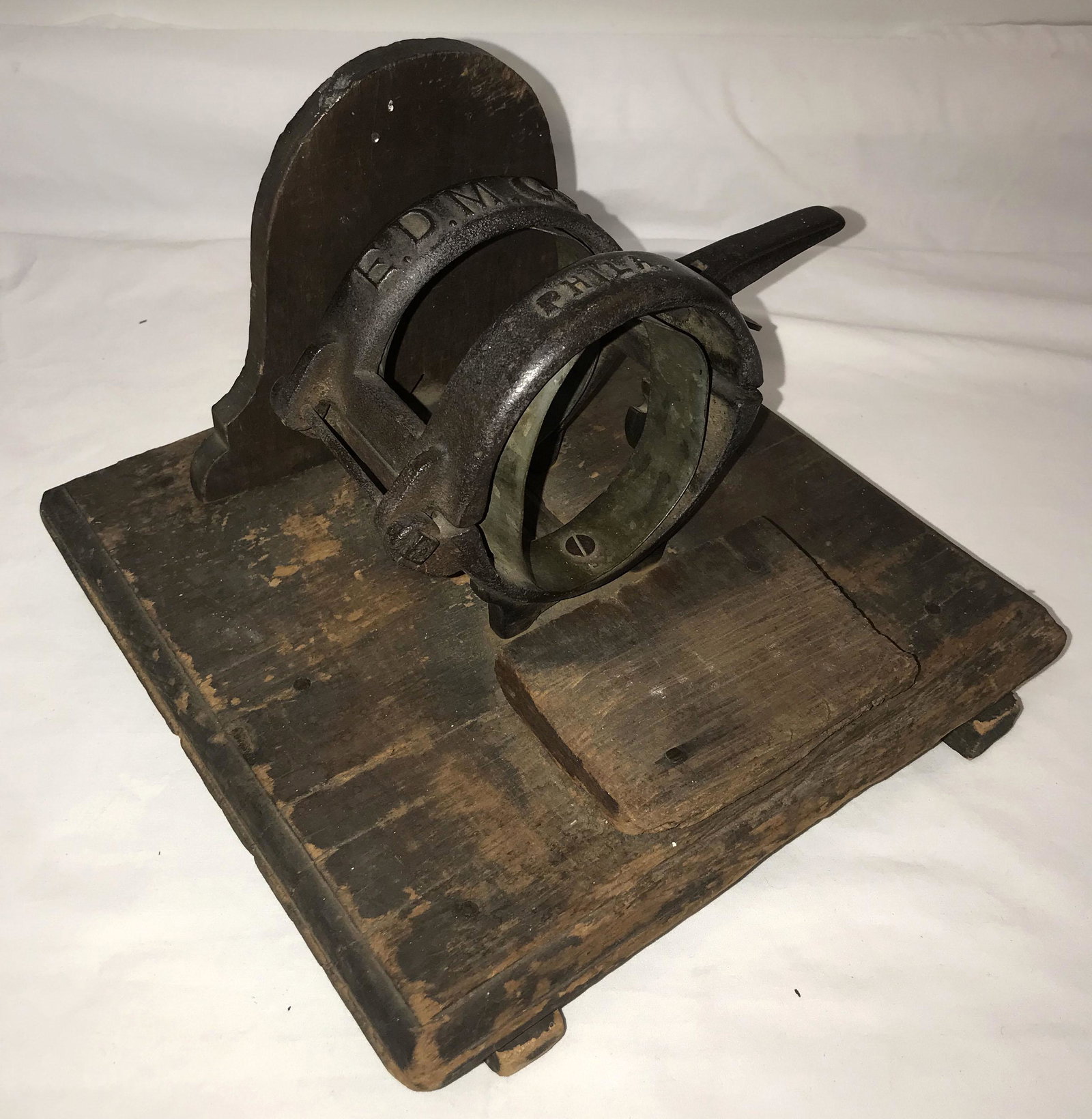 Vintage Asparagus Buncher: Vintage iron asparagus buncher mounted on a square wooden base, marked E.D.M. Co., older original wear, 7 3/4" T x 11" square base