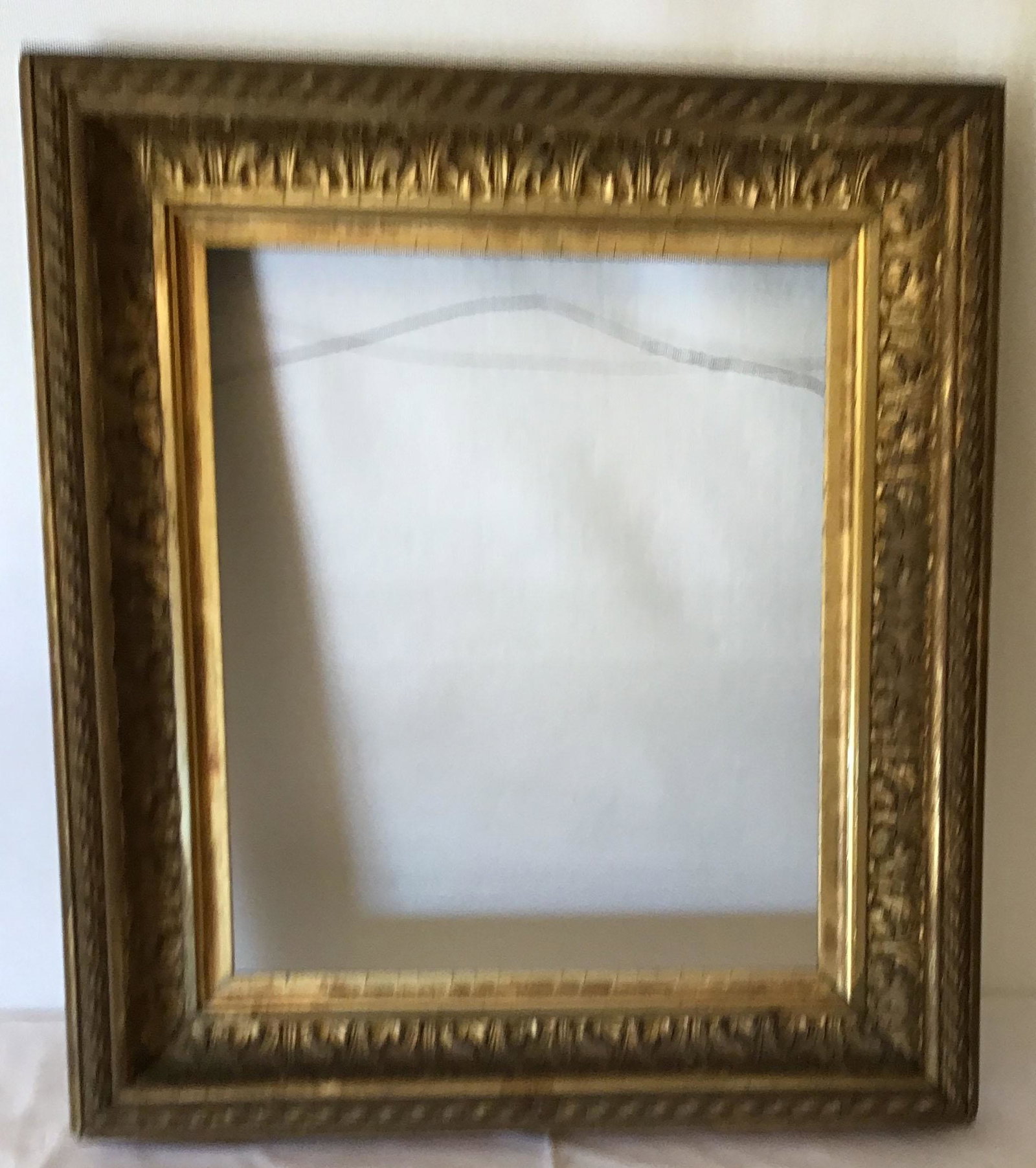 Victorian Gold Gessoed Frame: 19th C. Victorian gold gessoed frame, rope form design w/interior leaf form decoration, small piece of rope missing lower right hand corner, minor surface loss & deterioration visible in corners, 19 1
