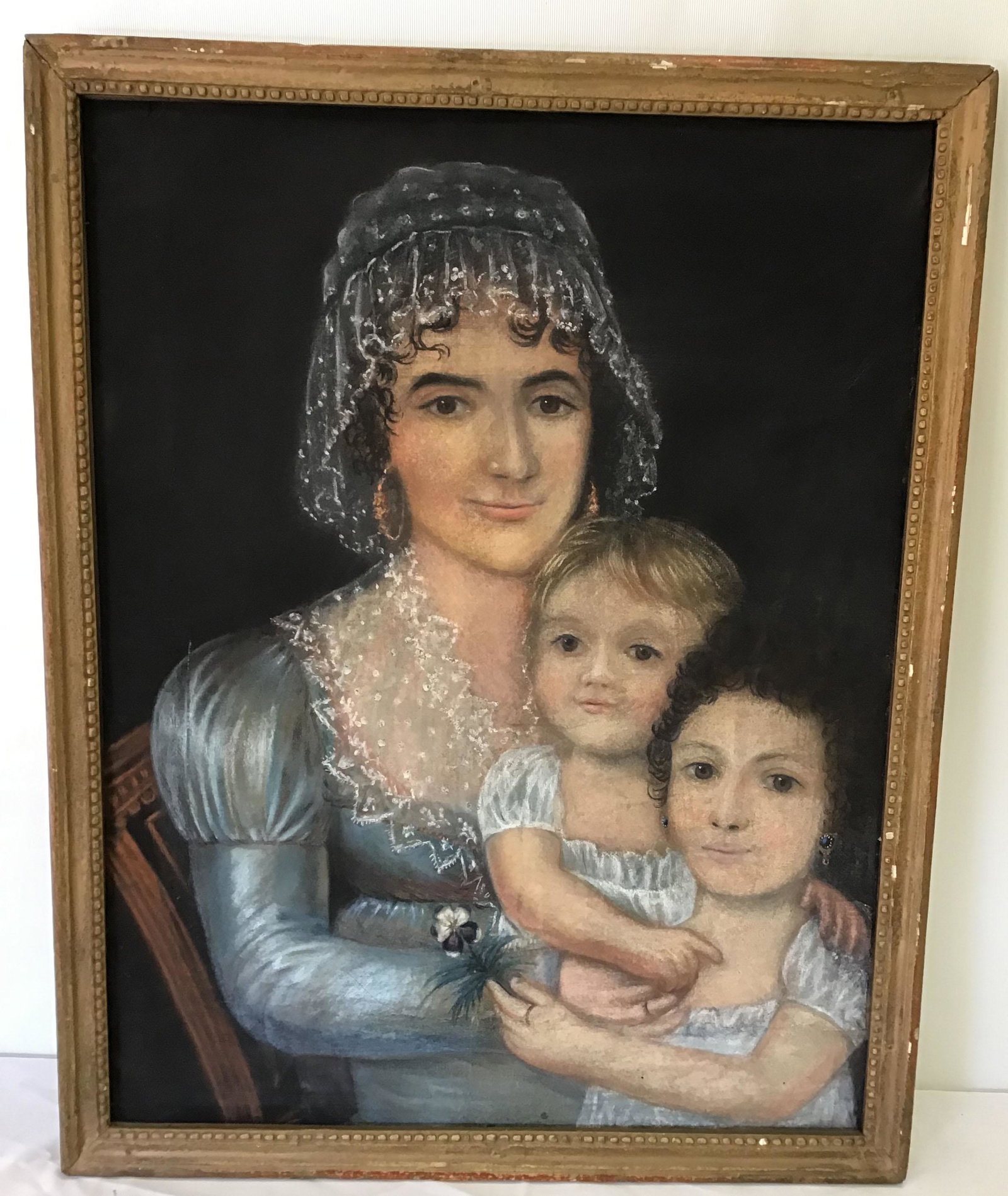 Portrait of Mother & 2 Children: Portrait of mother & 2 children, mixed media w/pastel & paint on canvas, mother wearing w/lace head covering & collar, blue dress, mother seated w/2 children on her lap, unsigined, image-24" x 19"; fr