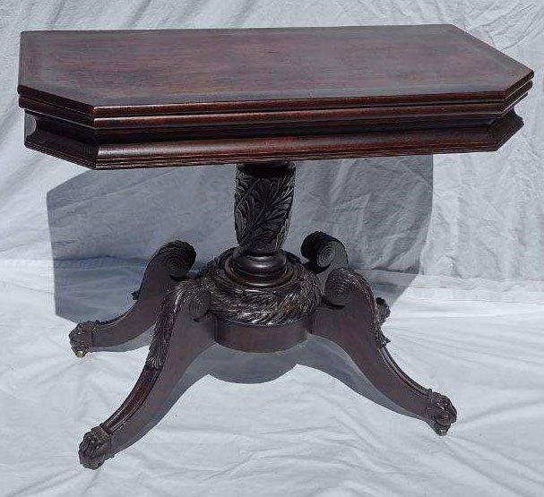 Vintage Dunacn Phyfe Games/Card Table: Vintage Duncan Phyfe mahogany games/card table, inlaid hinged swivel lid opening to 1 compartment, angled front corners over a turned leaf carved pedestal ending on 4 curved legs w/leaf carved knees a