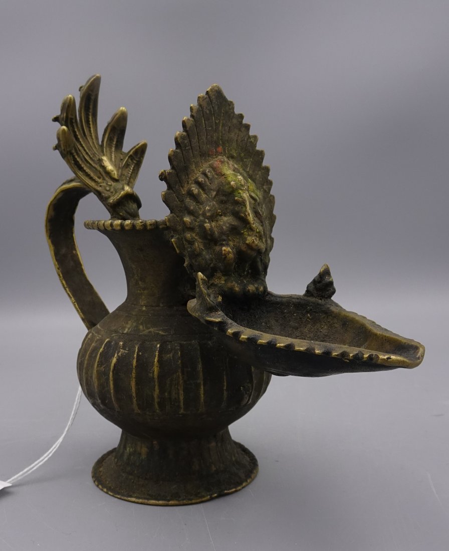 ANTIQUE INDIA BRASS ARATI OIL LAMP GANESHA: Brass Arati 17-18th c. Snake heads shielding Vishnu-Lobed pouring spout with Ganesha---ALL PACKING & SHIPPING IS OUTSOURCED.Purchases can be picked up at our Ho-ho-kus gallery by appointment only- Ple
