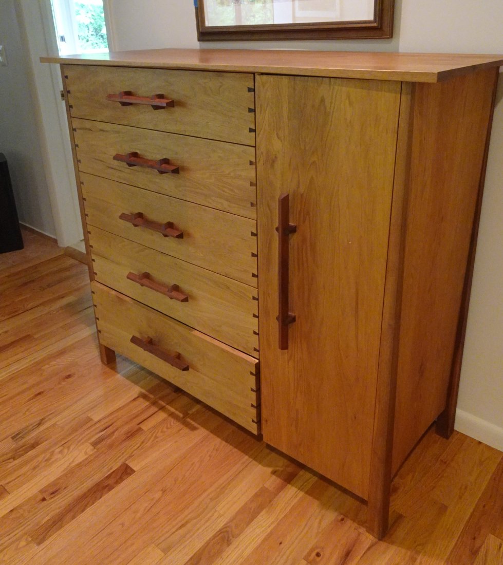 JEFFREY GREENE CABINET: Jeffrey Greene Cabinet USA, c. 1990s -48" h Ã— 54" w Ã— 22" d in Cabinet features expressive grain, butterflies, five large drawers on left,one large door right that opens to five fitted drawers