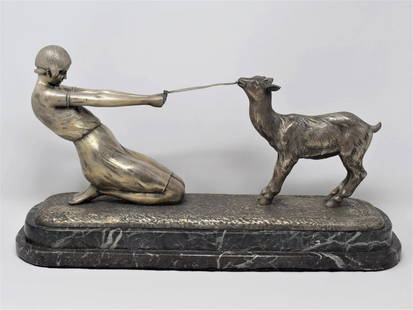 MAX LE VERRIER JANLE ART DECO FRENCH SILVER BROBZE STATUE: Well done French Art deco silver bronze statue featuring a kneeling youth playing with a goat, set onto a green marble base. Signed " Janle" on top of the base-executed at the Max Le Verrier Foundry