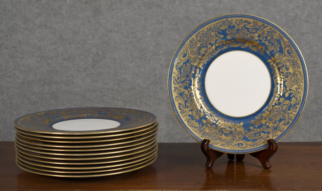 SET OF 12 MAGNIFICANT VINTAGE WEDGWOOD DINNER PLATE: A set of 12 vintage Wedgwood porcelain plates with dark blue border with gilt decoration.--10.75” dia.--Condition: very good, minor gilt wear--From the Estate of Barbara Kanash art dealer and co
