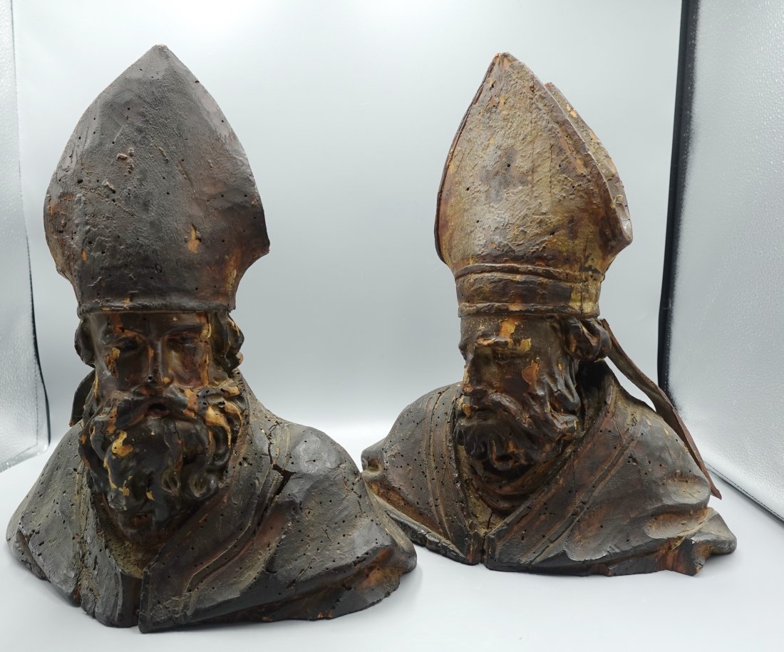 A PAIR OF ITALIAN RELIQUARY RELIGIOUS ICON BUST 17th CENTURY: Fully sculptured busts carved in wood with scant remnants of the original painting. Representing two bishops with mitre and cope-Slight worm damage here and there as seen, the tip of both mitre have l