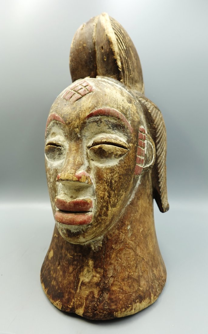 ANTIQUE PUNA AFRICAN FACE HELMET MASK: Very nice wood and pigment Puna mask as seen-Measures 16" tall-has some loss to wood at top as seen-provenance:From the Estate of Barbara Kanash art dealer and collector Saddle River NJ----Purchases c