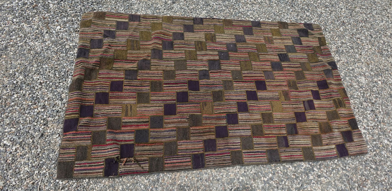ANTIQUE AMERICAN EARLY 1900s CHECKERBOARD HOOKED RUG: ANTIQUE AMERICAN CHECKERBOARD HOOKED RUG-measures 69" x 42" across-small area where fabric has come lose as seen-Age related wear overall good-a very nice early textile!!--From the Estate of Barbara K