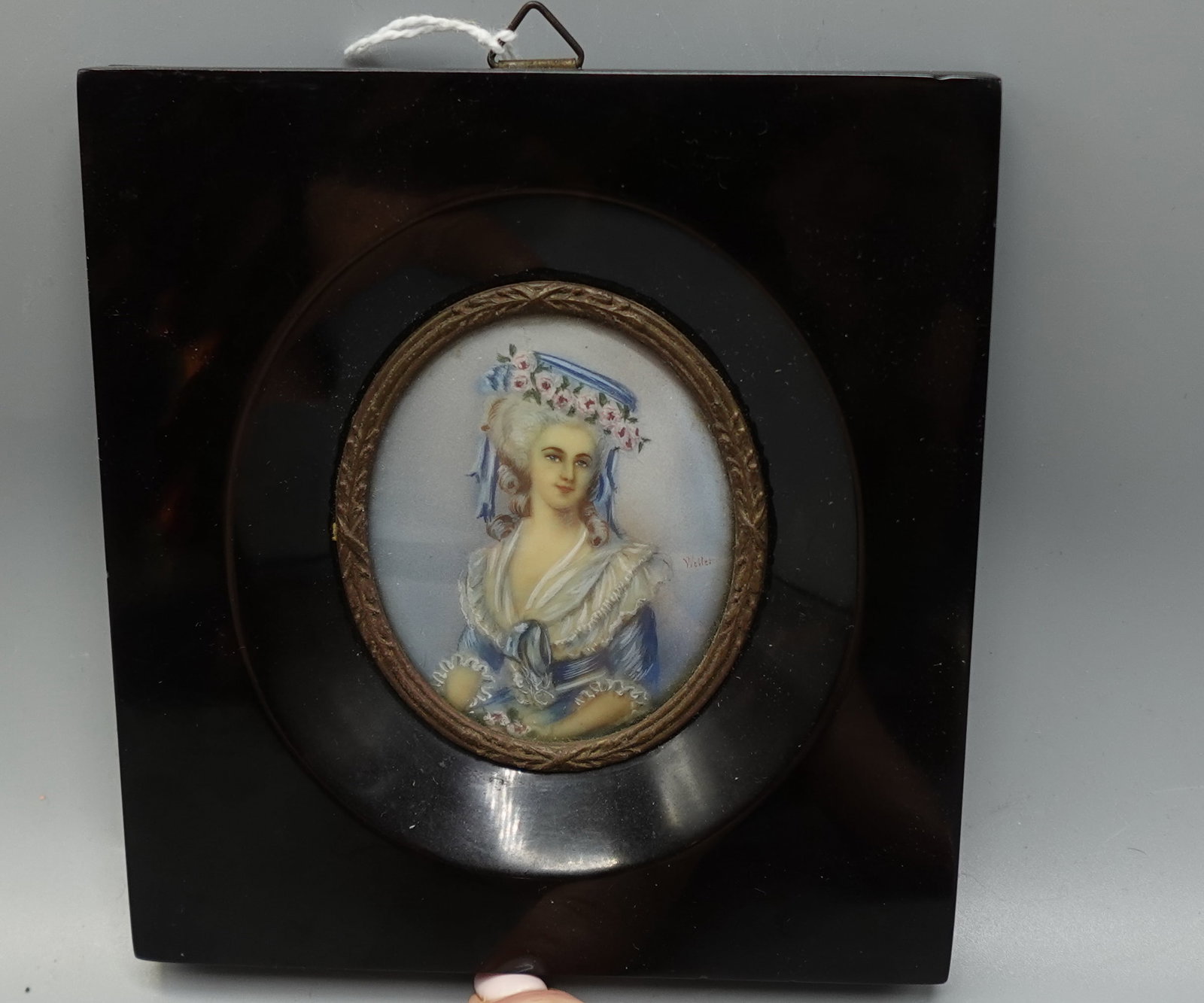 ANTIQUE PORTRAIT PAINTING ON IVORY IN FAUX TORTOISE FRAME: Beautiful oval portrait of Marie Antoinette in a rectangular Faux tortoise frame-signed--measures 5" x 4.5" across framed-back of frame is loose-overall good--From the Estate of Barbara Kanash art dea