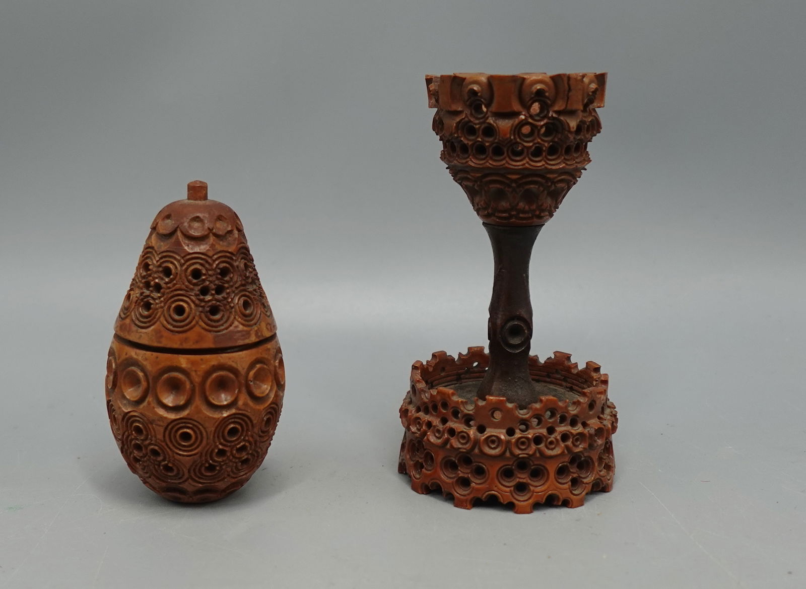 19c CARVED COQUILLA NUT EGG CUP & SEWING SNUFF BOX: Two 19c items-one Antique hand carved coquilla nut sewing,needle or snuff case?-- in the form of an egg. Twists open to reveal open interior for storing small items-measures 2.75" tall-overall good co