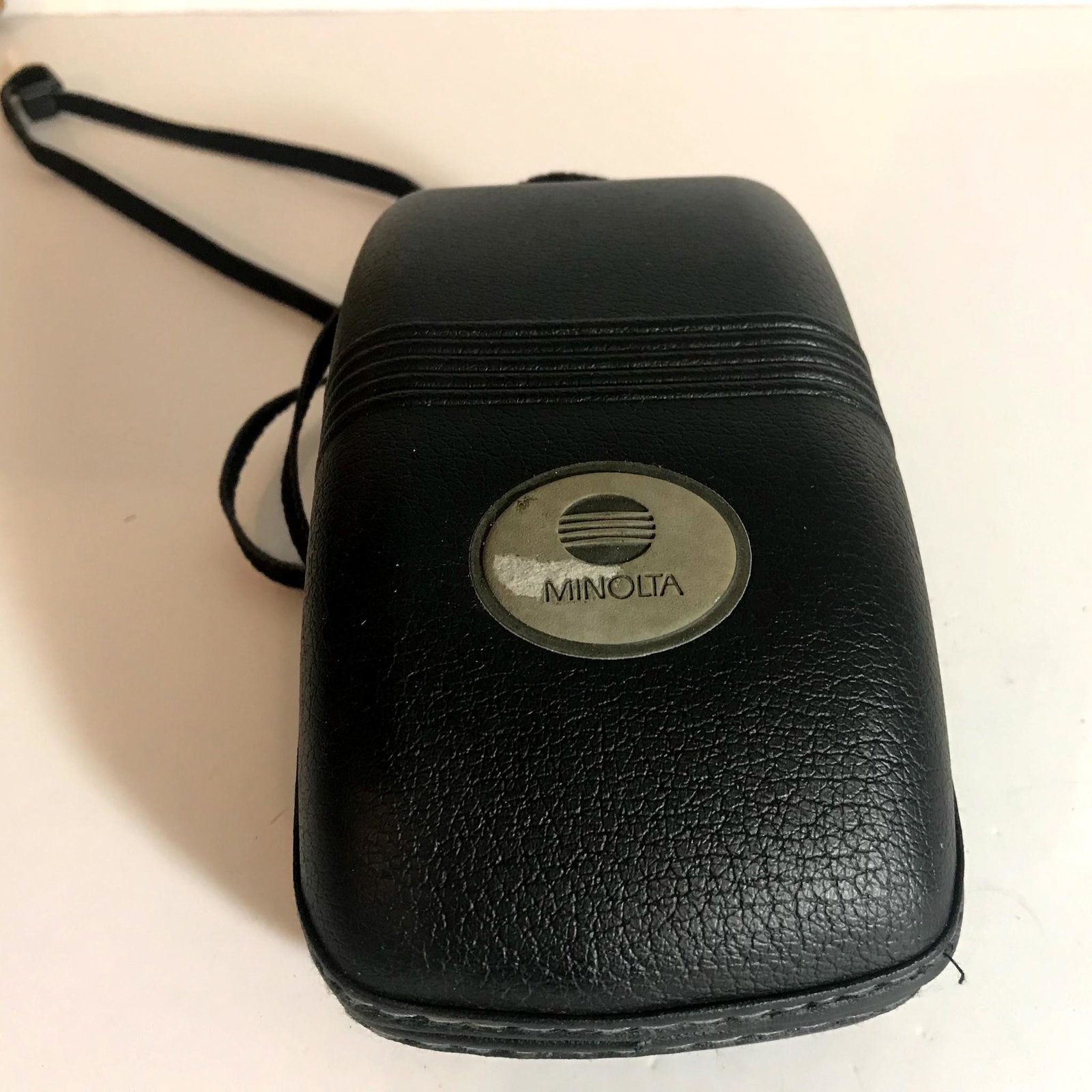 Minolta Mac-Tele Quartz Date Point & Shoot Camera.: Appperance is beautiful, tiny scuffs from normal use. It shows signs of use. *Please check photos.