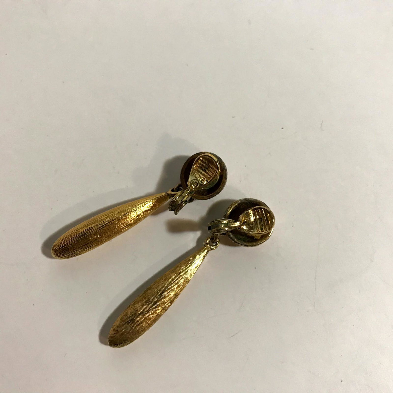 MONET brushed gold tone clip Dangle Earrings: Vintage signed MONET brushed gold tone clip-on Dangle Earrings Please view all photos as they are part of the description and condition of this Item, Feel free to contact me with questions or picture