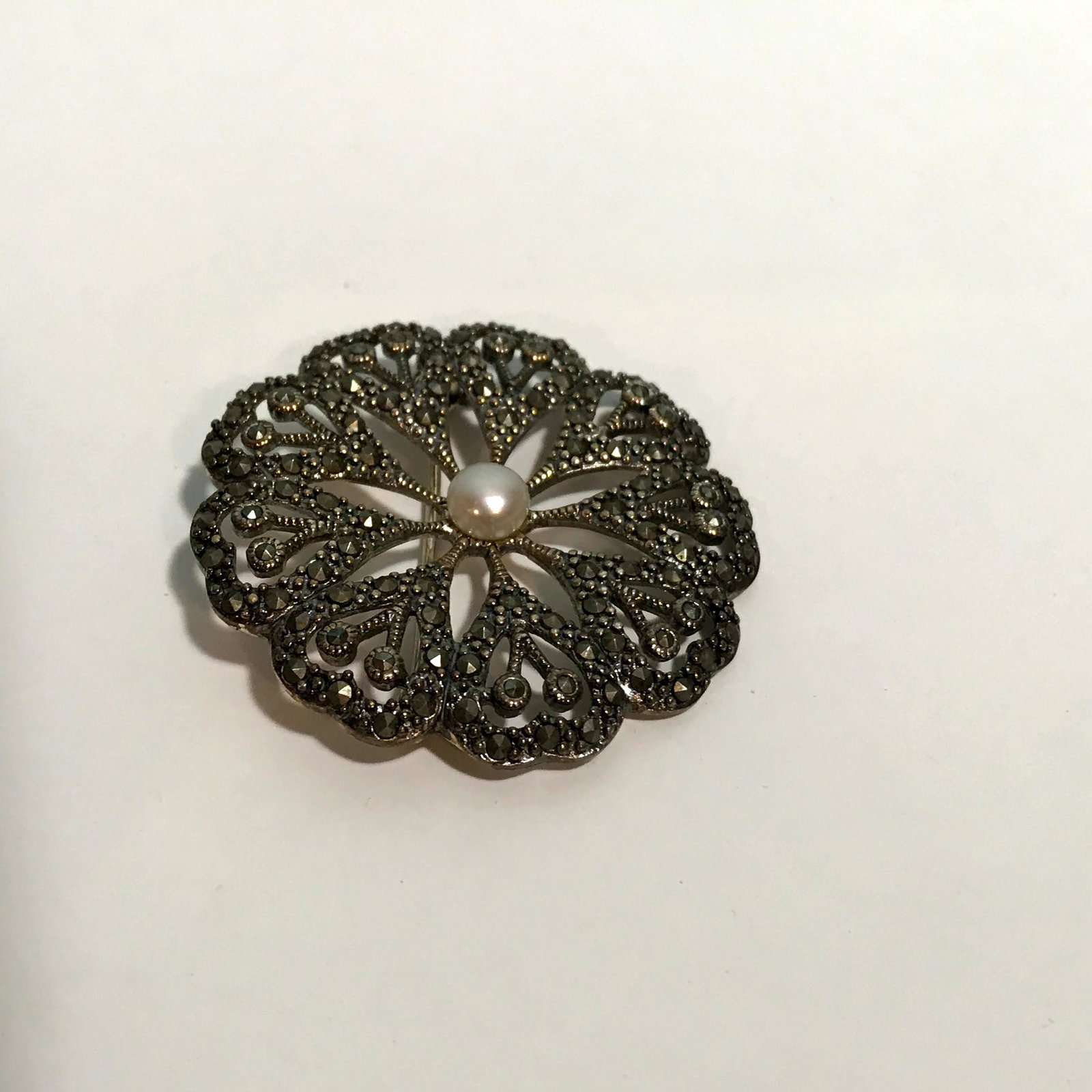 vintage sterling silver marcasite brooch: vintage sterling silver marcasite brooch wreath Thailand with Pearl Please view all photos as they are part of the description and condition of this Item, Feel free to contact me with questions or pic
