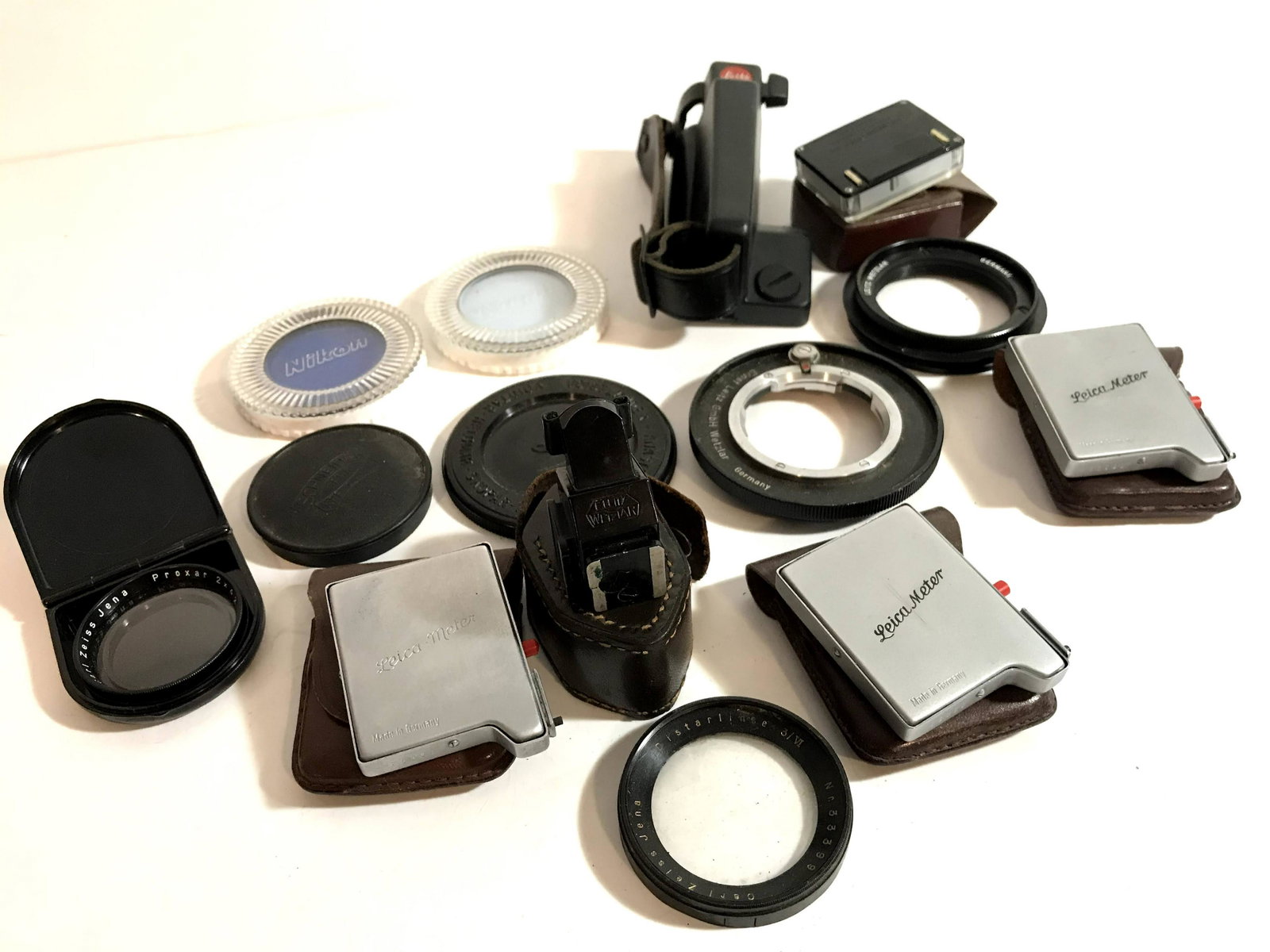 Lot of adapters, Leica meters Filters and more!: Lot of adapters, Leica meters Filters and more! Please view all photos as they are part of the description and condition of this Item, Feel free to contact me with questions or picture requests!.