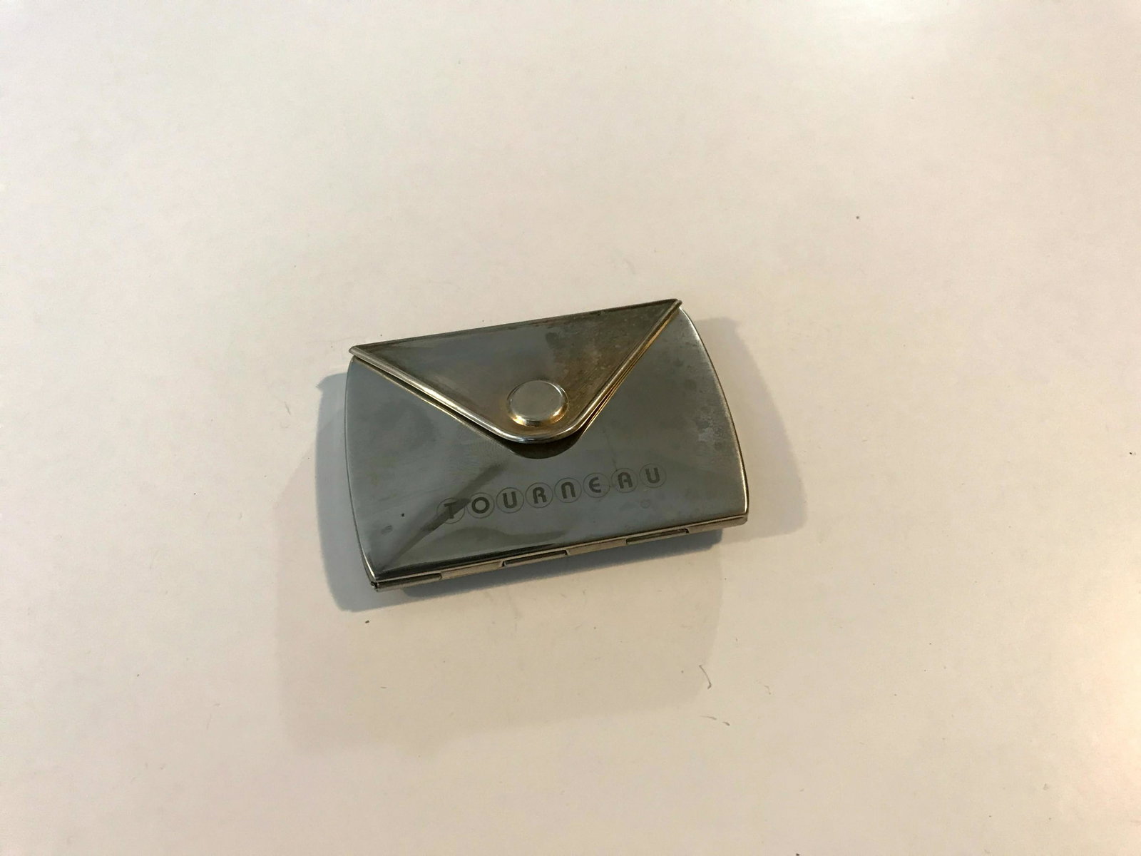 Tourneau Purse - Fold Up Double Mirror silver: Tourneau Purse - Fold Up Double Mirror silver Please view all photos as they are part of the description and condition of this Item, Feel free to contact me with questions or picture requests!. Used I