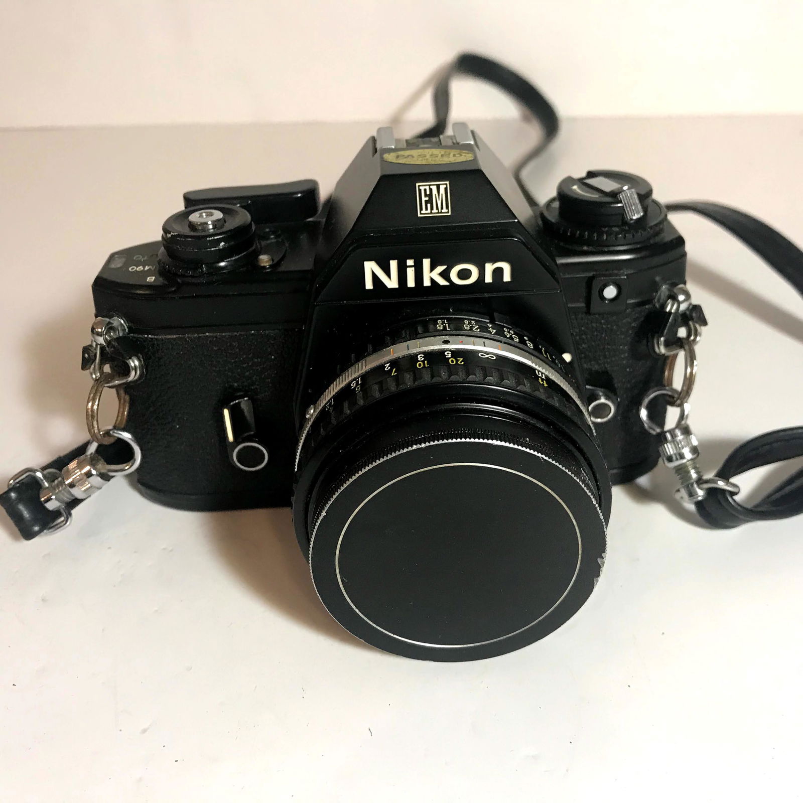 Nikon EM SLR Film CAMERA Chrome +50mm F1.8 MF Nikon: This camera is used in excellent cosmetic condition almost mint with only slight traces of use.