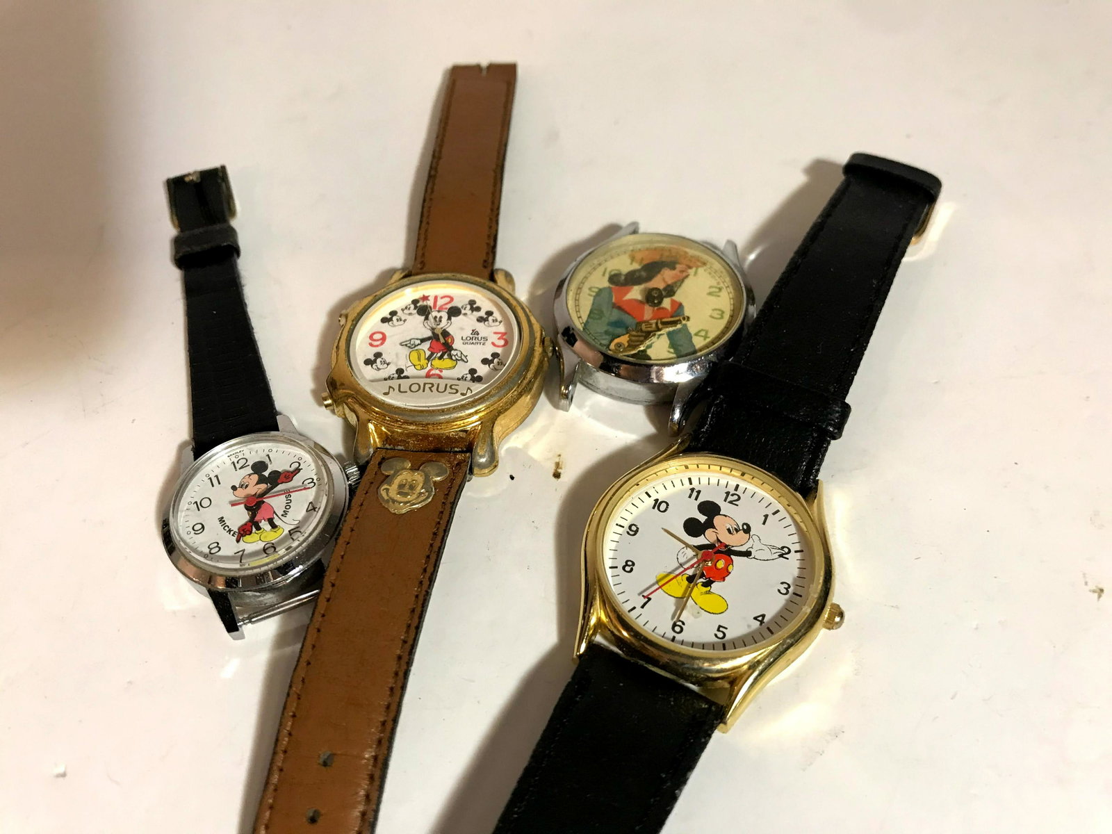 Lot of 4 cartoon Watches Lorus Mickey: Lot of 4 cartoon Watches Please view all photos as they are part of the description and condition of this Item, Feel free to contact me with questions or picture requests Used Item AS IS