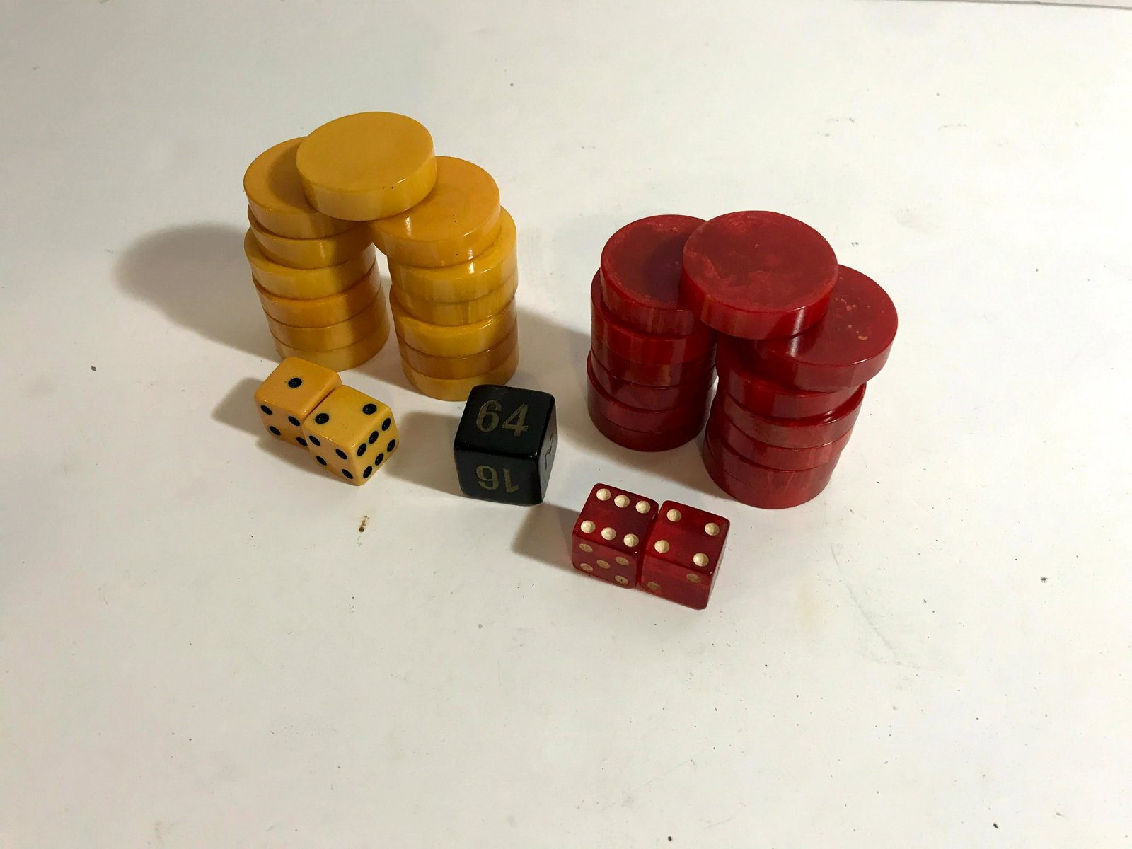 Vtg Bakelite 26 Pc Butterscotch Red Backgammon: Vtg Bakelite 26 Pc Butterscotch Red Backgammon 1 5/16" by 5/16" Please view all photos as they are part of the description and condition of this Item, Feel free to contact me with questions or picture