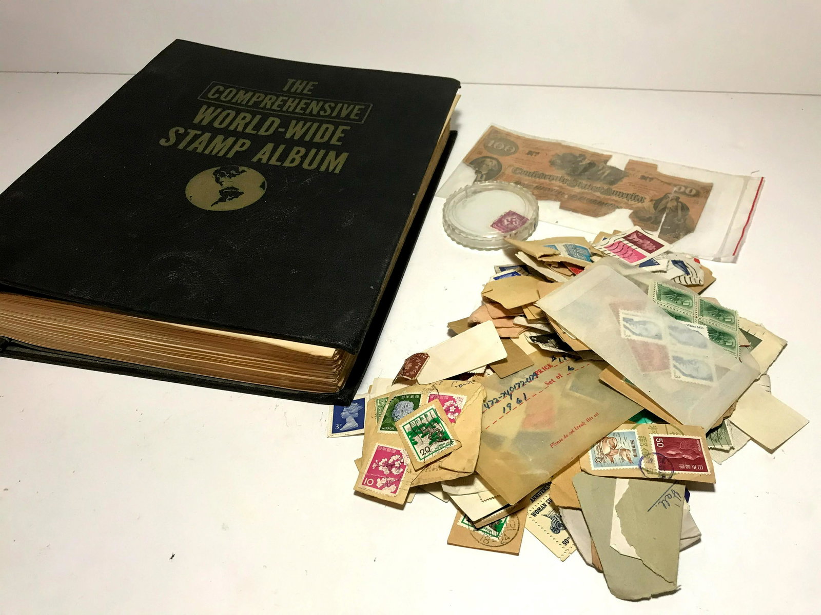 Book old stamps and Confederate $100 Bill: Book old stamps and Confederate Money Please view all photos as they are part of the description and condition of this Item, Feel free to contact me with questions or picture requests Used Item AS IS