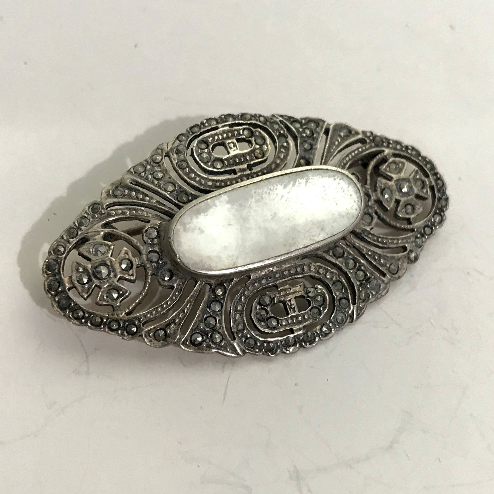 Brooch Vintage Mother Of Pearl Marcasite Brooch: Brooch Vintage Mother Of Pearl Marcasite Brooch Please view all photos as they are part of the description and condition of this Item, Feel free to contact me with questions or picture requests!
