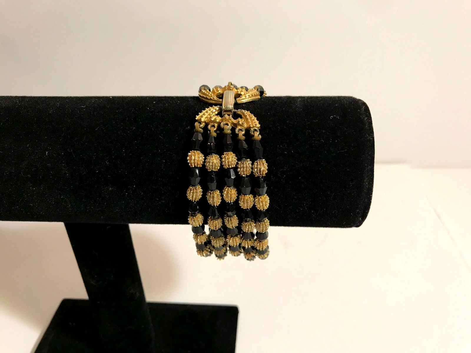 Vintage Trifari Black Beads Goldtone Bracelet: Vintage Crown Trifari Black Beads Goldtone Bracelet Please view all photos as they are part of the description and condition of this Item, Feel free to contact me with questions or picture requests Us
