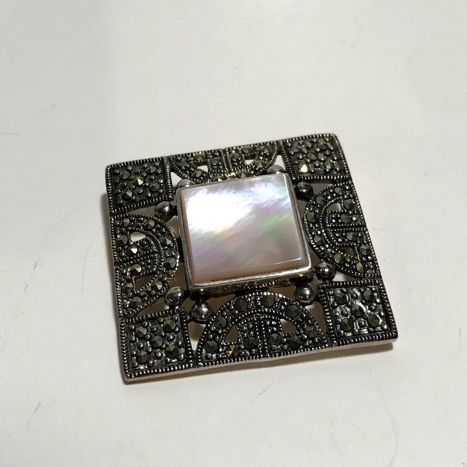 Vintage 1950s SILVER marcasite mother of pearl BIG 1.5": Vintage 1950s SILVER marcasite mother of pearl BIG 1.5" ornate brooch. Please view all photos as they are part of the description and condition of this Item, Feel free to contact me with questions or 