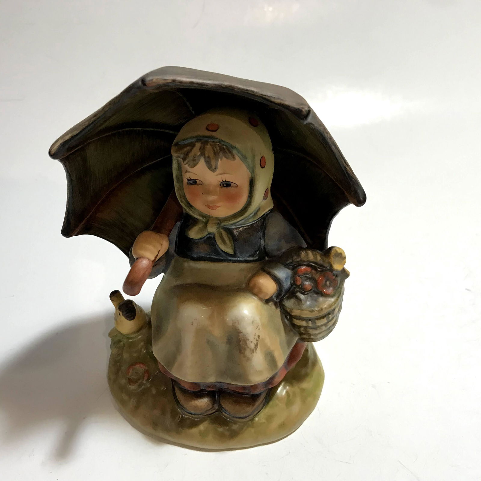 Goebel Hummel "Smiling Through" #408/0: Goebel Hummel "Smiling Through" #408/0 Please view all photos as they are part of the description and condition of this Item, Feel free to contact me with questions or picture requests Used Item AS IS