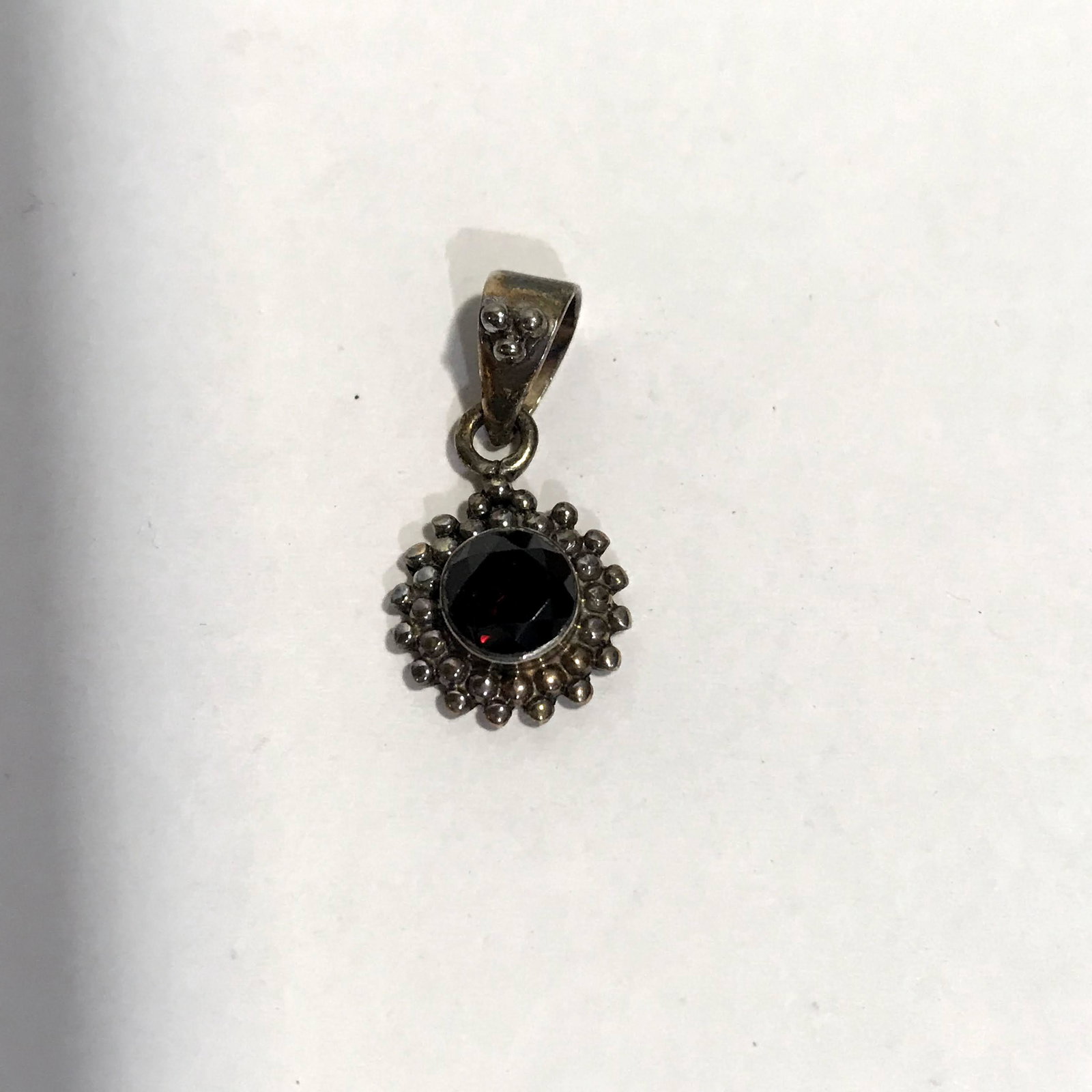 Vintage Small Ruby Red Sterling Pendant: Vintage Small Ruby Red Sterling Pendant Please view all photos as they are part of the description and condition of this Item, Feel free to contact me with questions or picture requests!.Used Item AS 