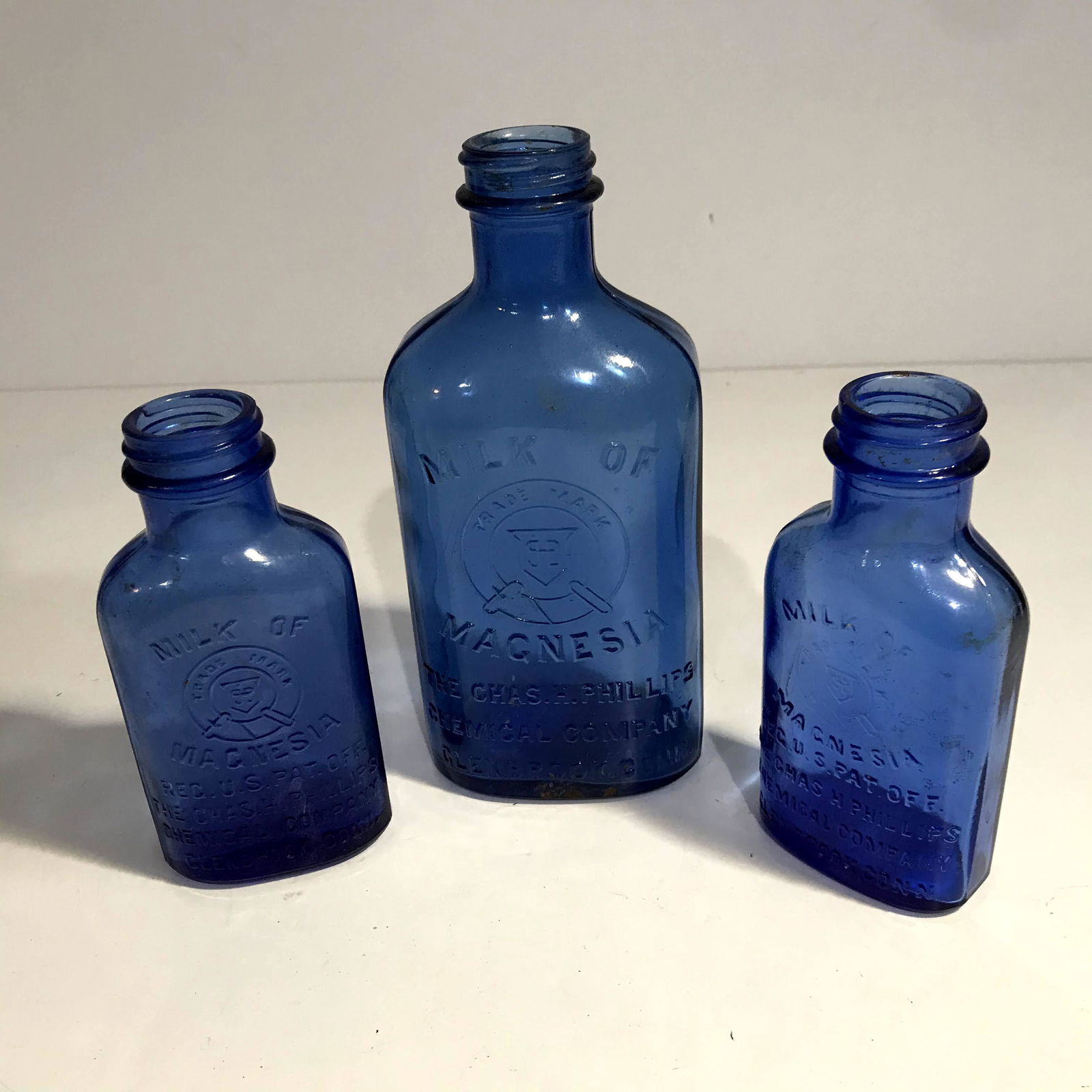 Set of 3 Vintage Phillips Milk Of Magnesia Cobalt Blue: Set of 3 Vintage Phillips Milk Of Magnesia Cobalt Blue Glass Bottles Please view all photos as they are part of the description and condition of this Item, Feel free to contact me with questions or pi