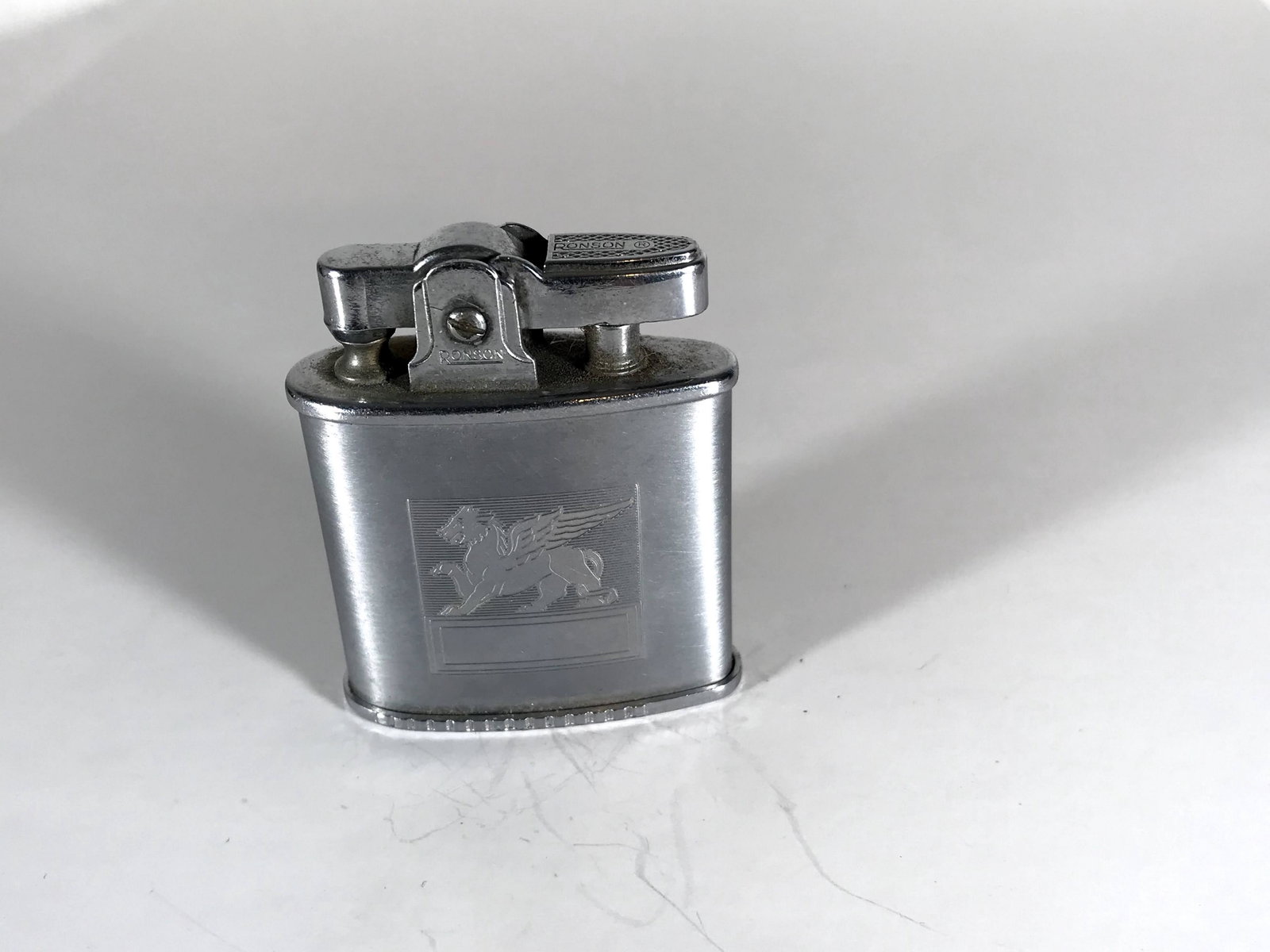 Working 1953 Ronson Triumph Winged Lion Vintage Silver: Working 1953 Ronson Triumph Winged Lion Vintage Silver Tone Lighter flint Please view all photos as they are part of the description and condition of this Item, Feel free to contact me with questions 
