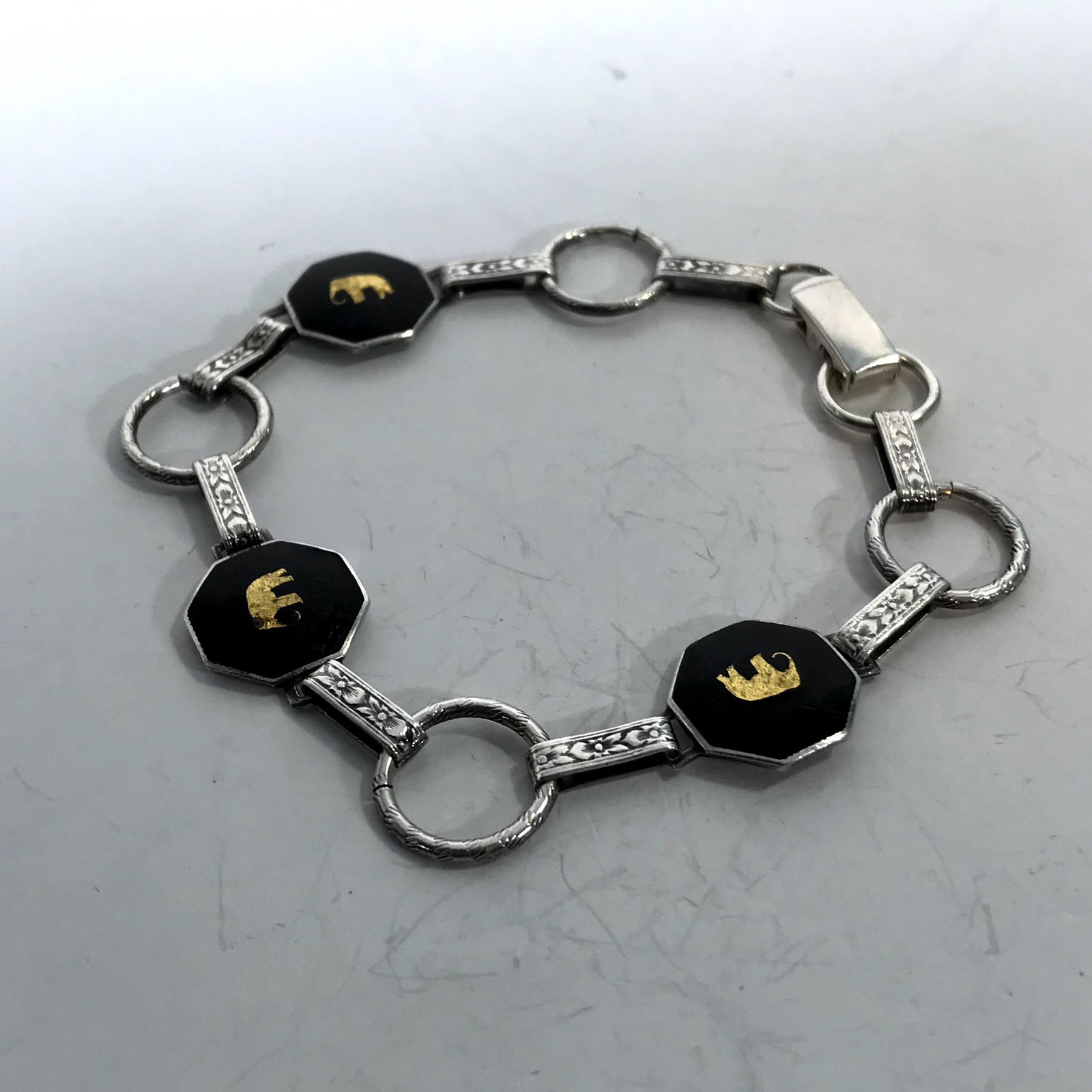 sterling silver Black enameled elephant bracelet 7": sterling silver Black enameled elephant bracelet 7" Please view all photos as they are part of the description and condition of this Item, Feel free to contact me with questions or picture requests! U
