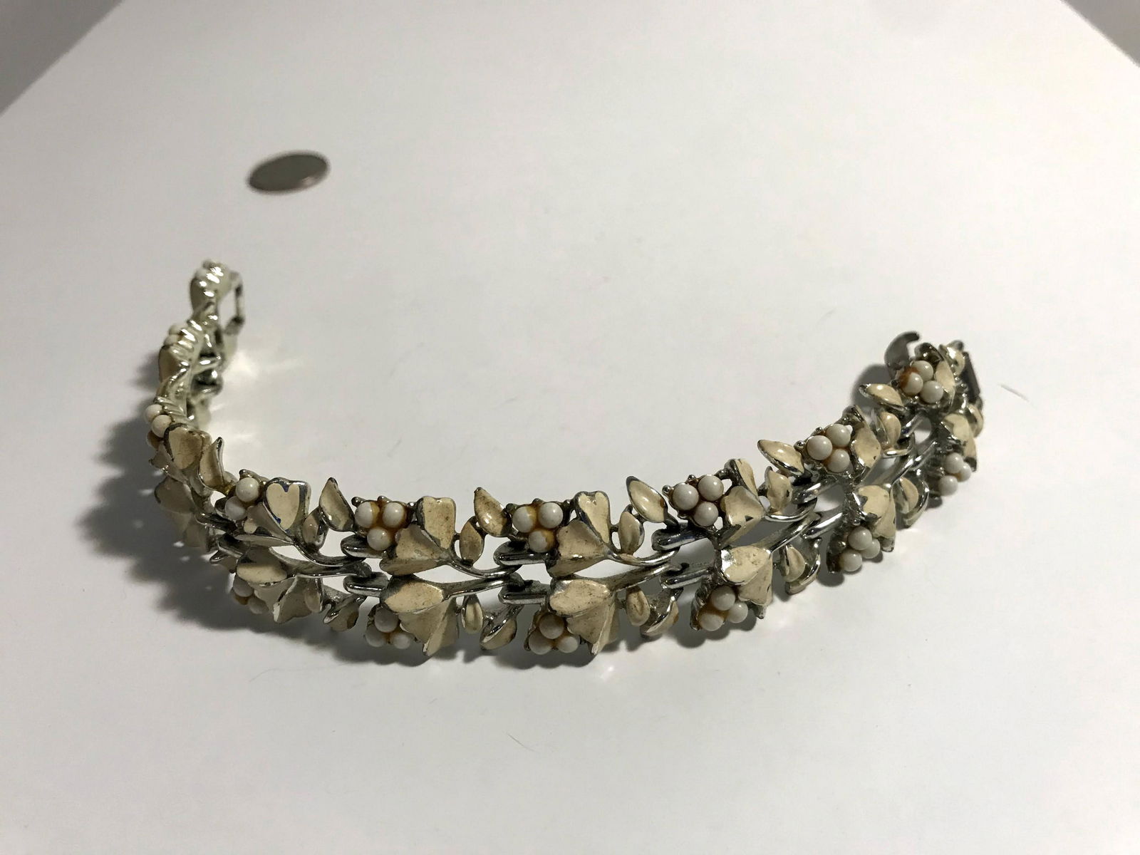 Vintage Coro 1940s/50s cream Enamel Flowers Bracelet: Vintage Coro 1940s/50s cream Enamel Flowers Bracelet Signed with Horse Please view all photos as they are part of the description and condition of this Item, Feel free to contact me with questions or